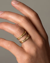 Gold Infinity Etched Bands on male model.