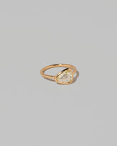 View from the side of the Gusher Chartreuse Sapphire Ring 003 on light color background.