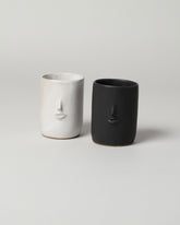 Group of Rami Kim Mini Face Tumbler on light color background.