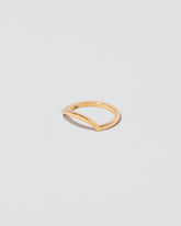 View from the side of the Gold Solid Square Wire Right Slump Band on light color background.