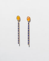 Ethiopian Opal Transformation Earrings on light color background.