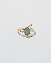 Saturnalia Ring on light color background.