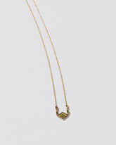 Radical Abstraction Necklace on light color background.