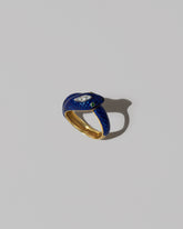 Closeup details of the Vintage Cartier Enamel Snake Ring on light color background.