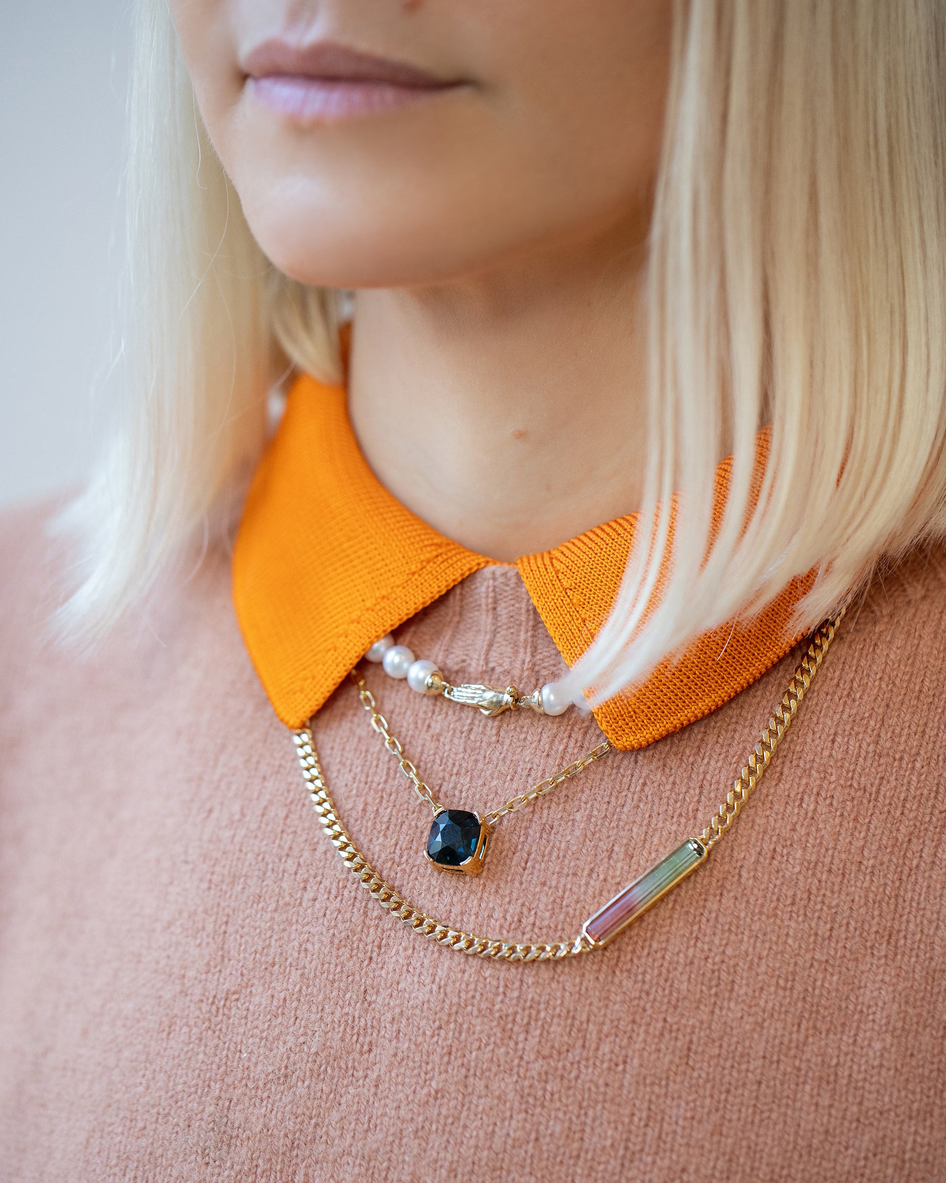 Gold White Union Necklace, Awareness Necklace and Deliverance Necklace on model.