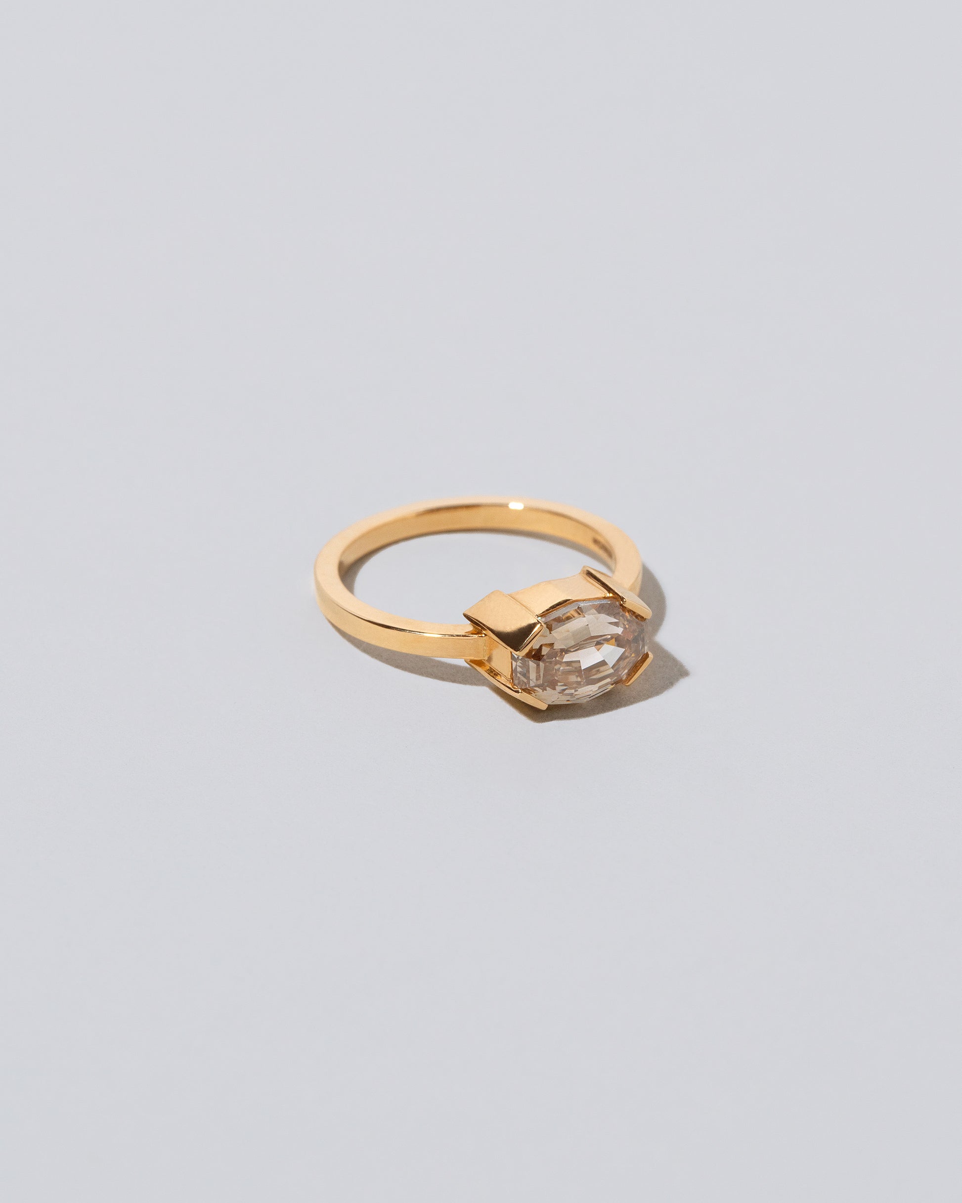 View from the side of the Metis Ring on light color background.
