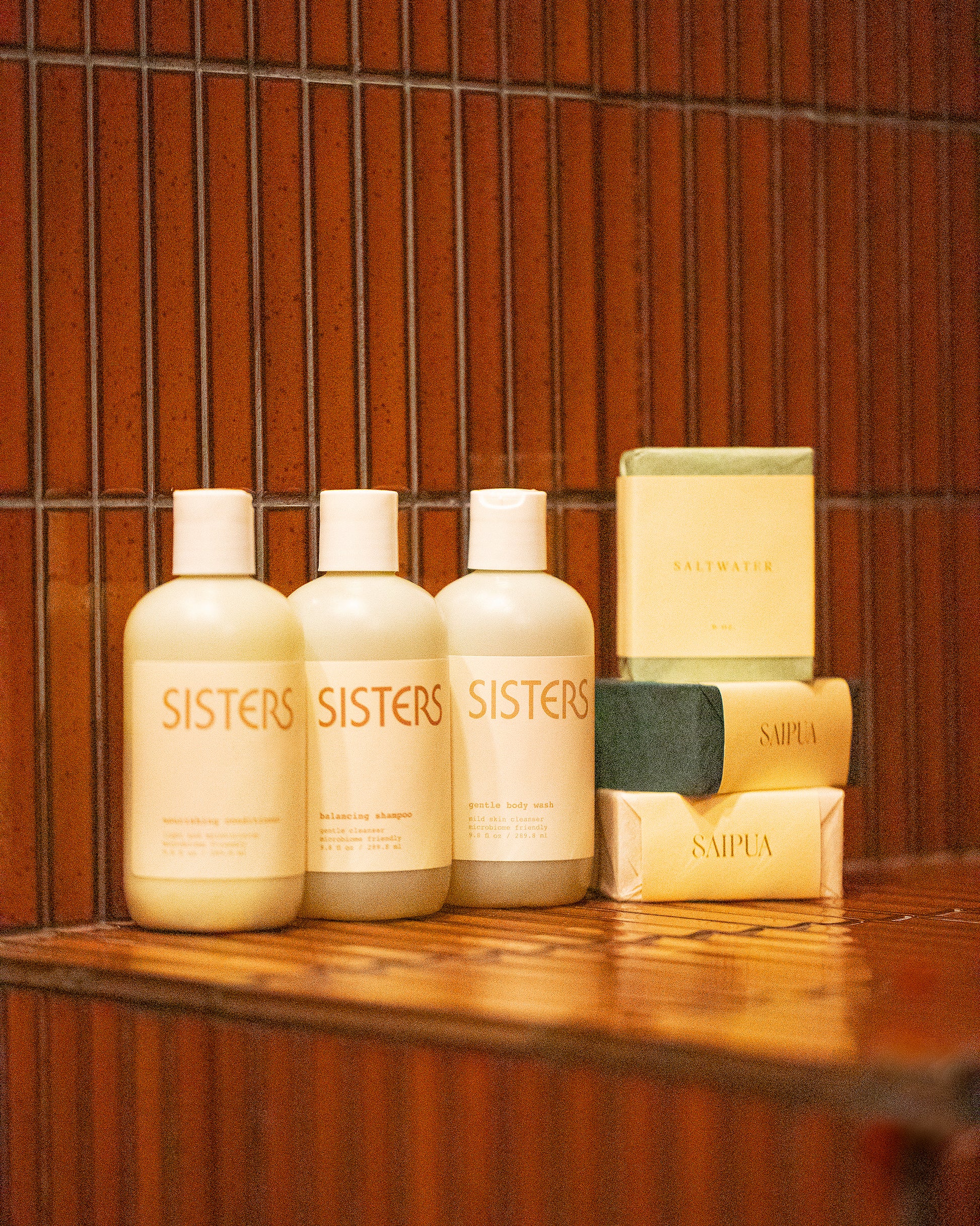 Sisters Body Gentle Body Wash, Balancing Shampoo and Nourishing Conditioner and Saipua Saltwater, Vetiver with French Green Clay, Black Soap with Charcoal and Patchouli bar soaps.
