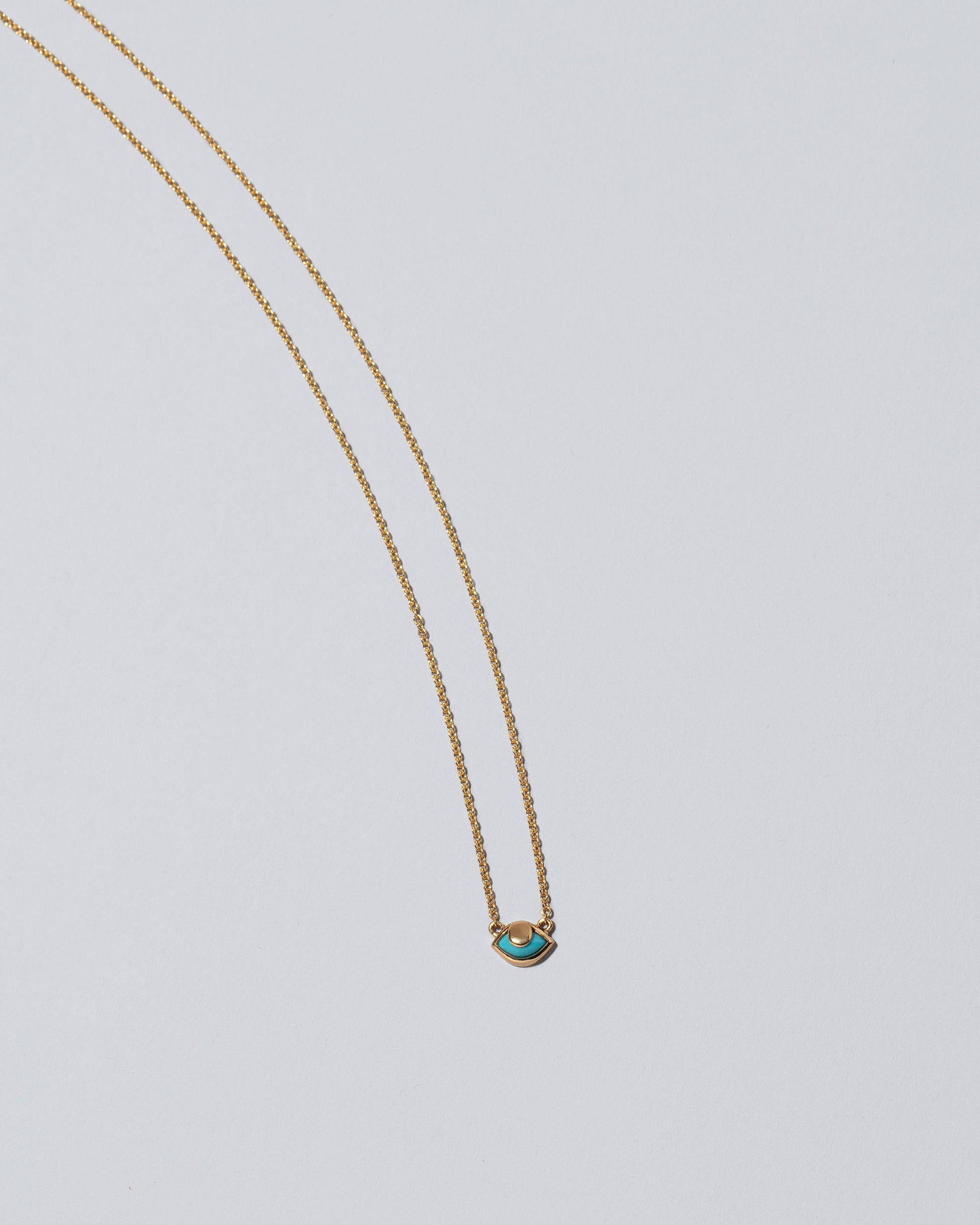 Eye See You Necklace on light color background.
