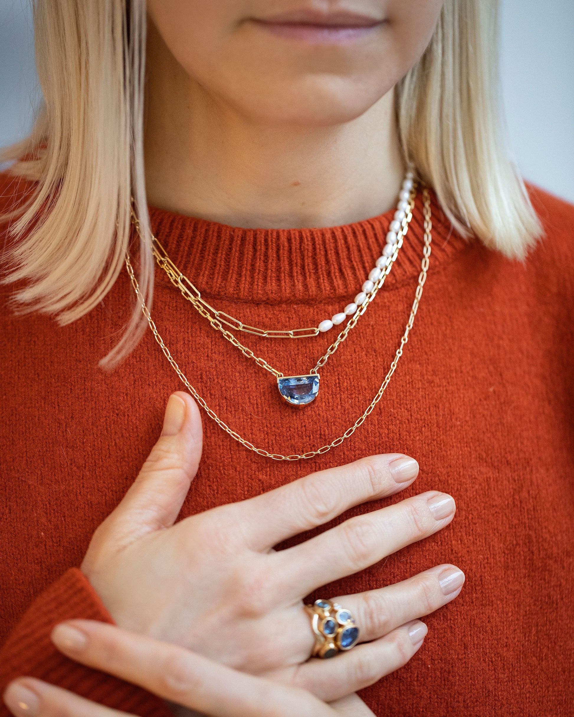 Rice Pearl Long Oval Necklace, Reverence Necklace and Hotdog Chain Necklace on model.