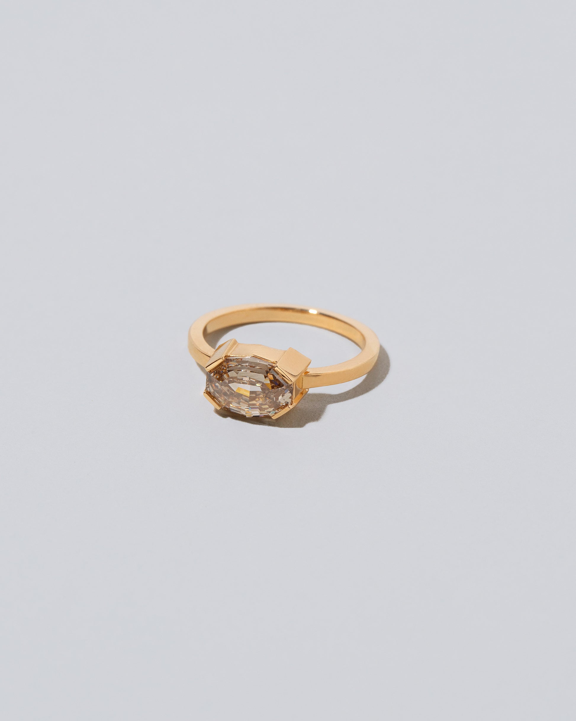 View from the side of the Metis Ring on light color background.