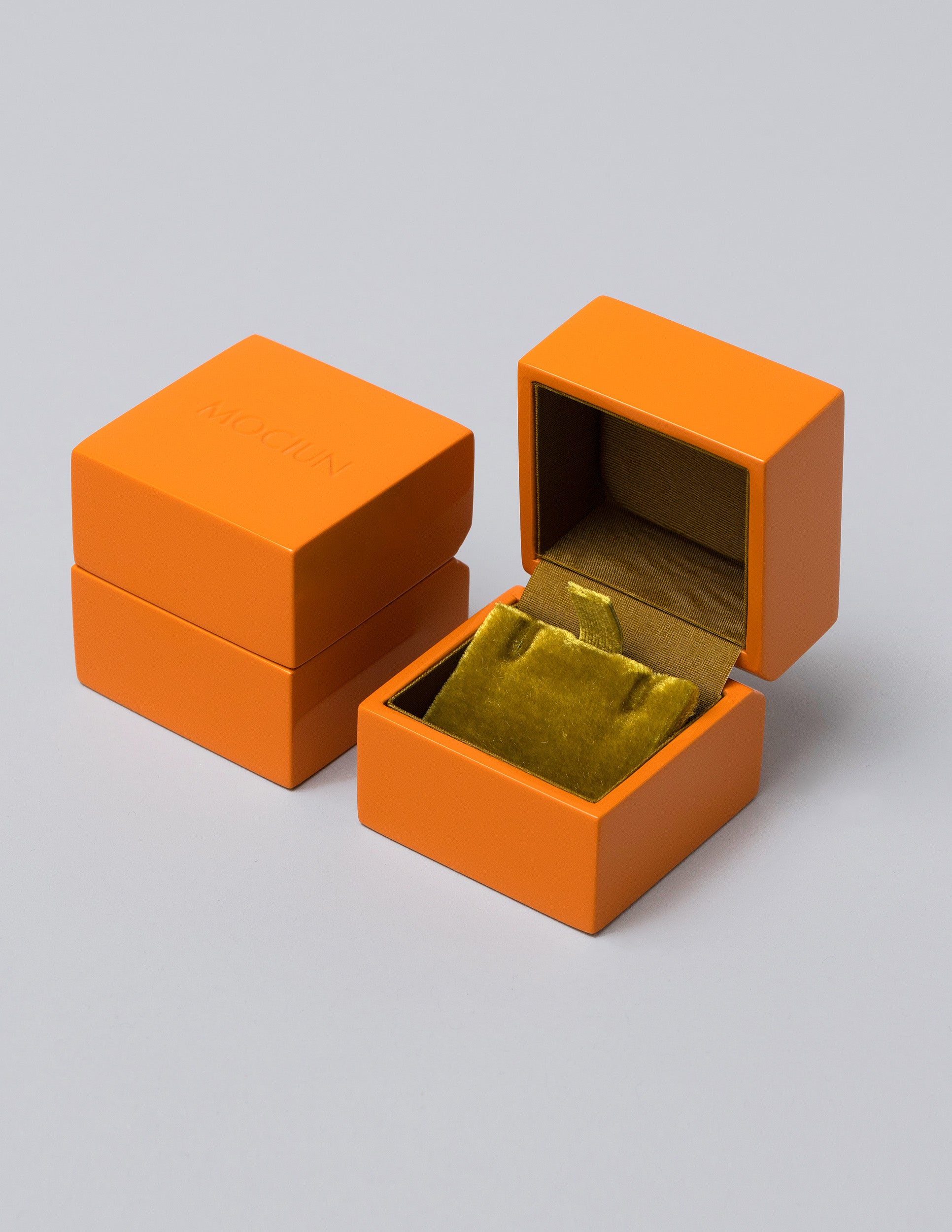 Earrings & Charms Orange Lacquer Box on light color background.