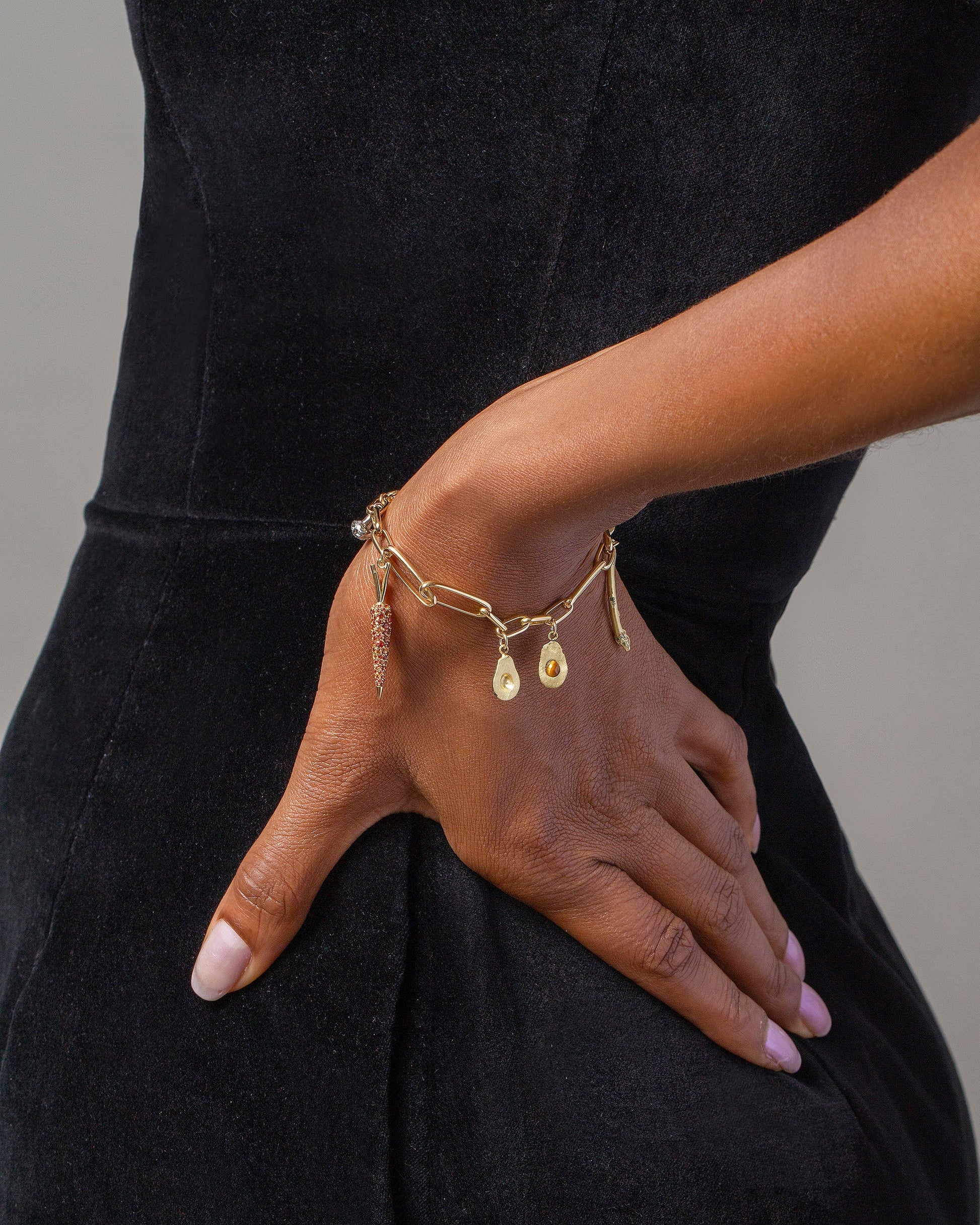 Avocado Charm, Asparagus Charm, Carrot Charm and Long Loop Chain Bracelet on model.
