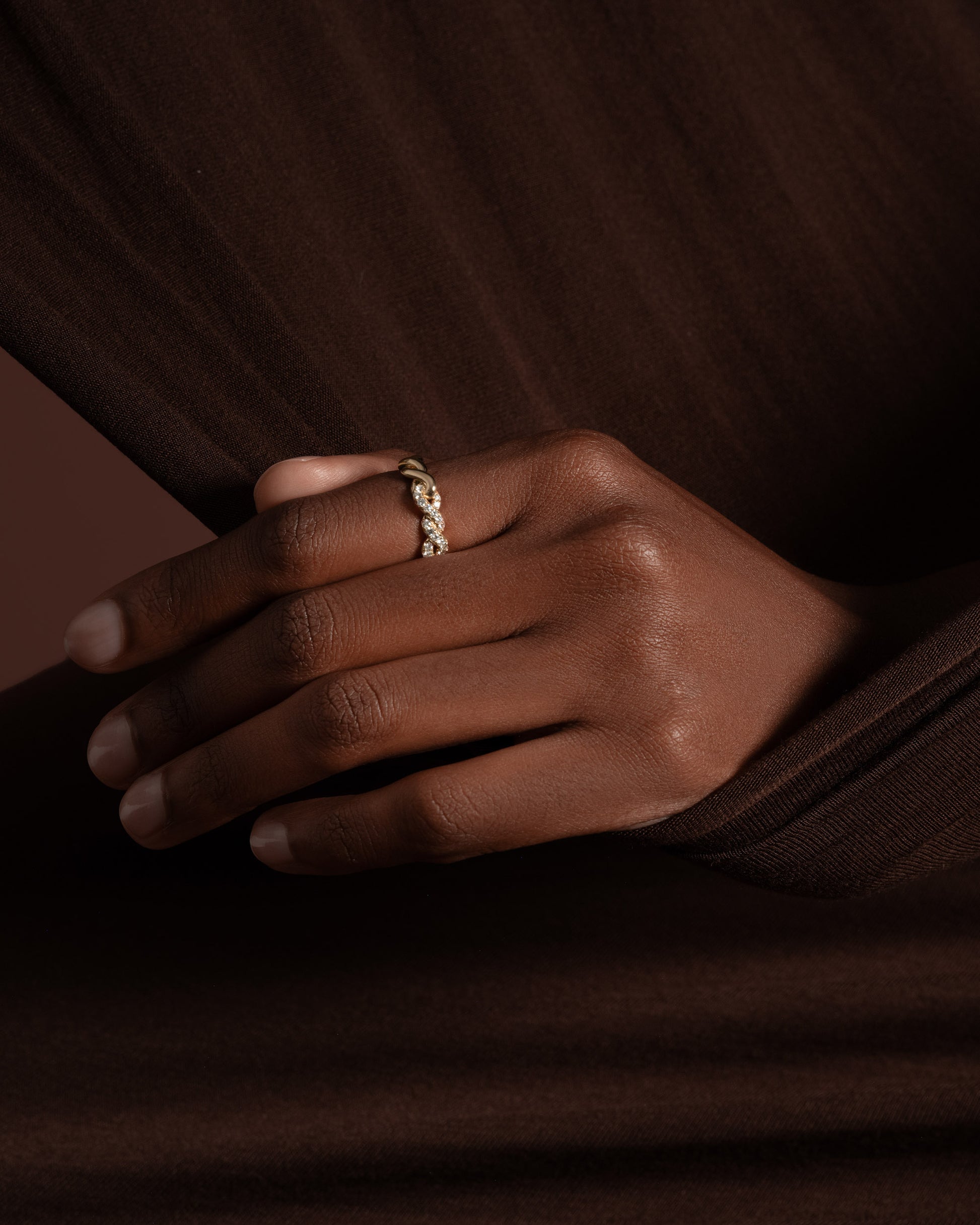 Styled image featuring the Gold Pavé Twist Band on model.