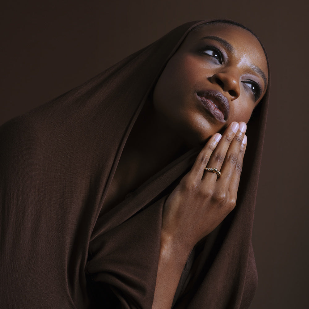 product_details::Styled image featuring the Gold Pavé Bind Band on model.