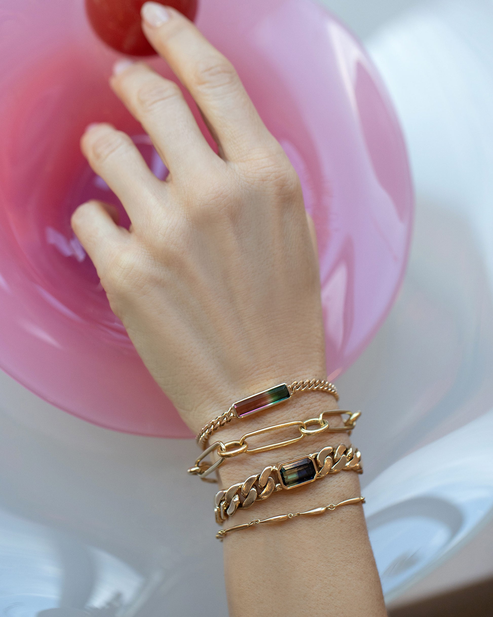 Fluid Bracelet, Link Bracelet, Tenacity Bracelet and Accumulation Bracelet on model.