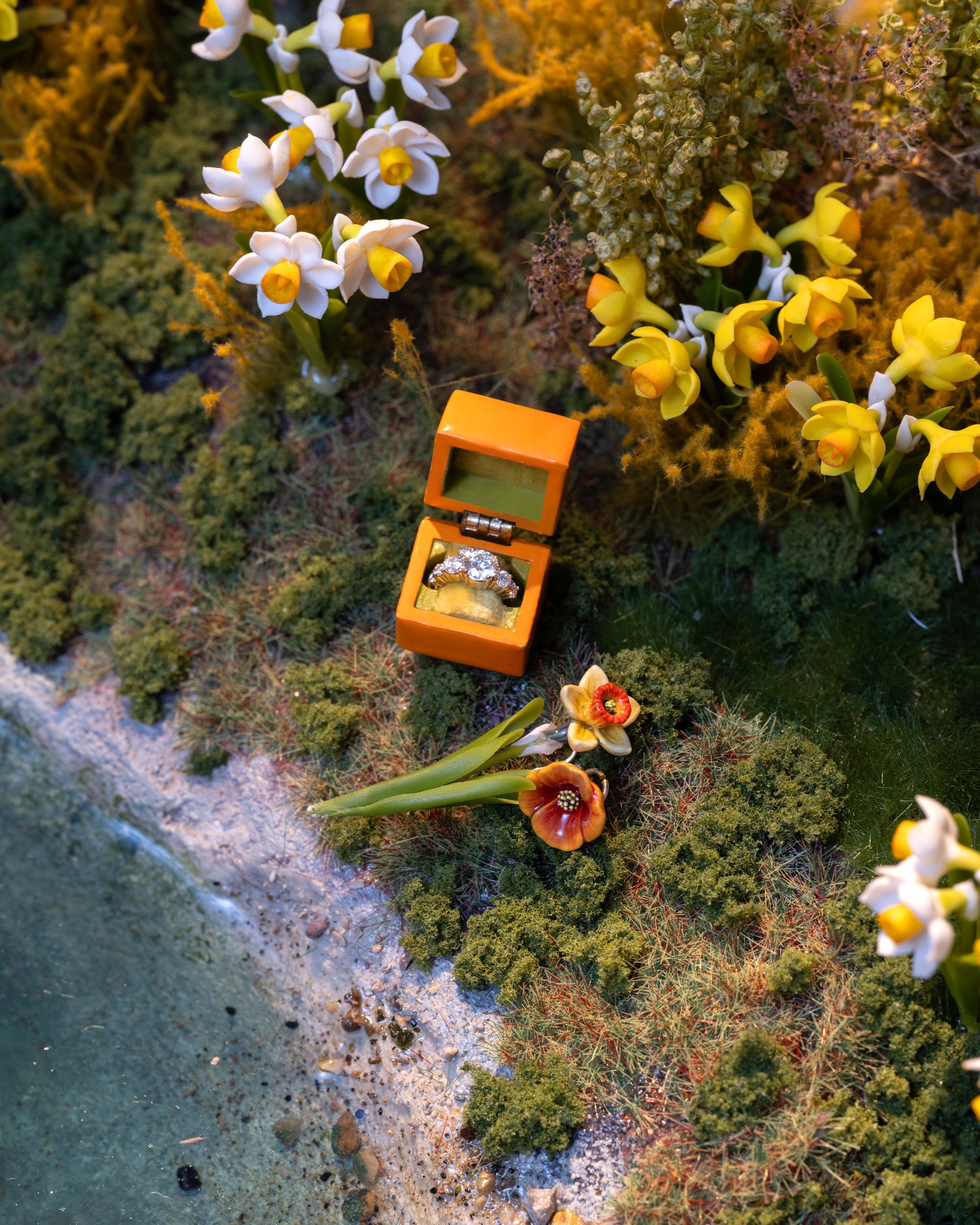 Styled image featuring the Luna Ring Charm, with the California Poppy Charm and Daffodil Charm.