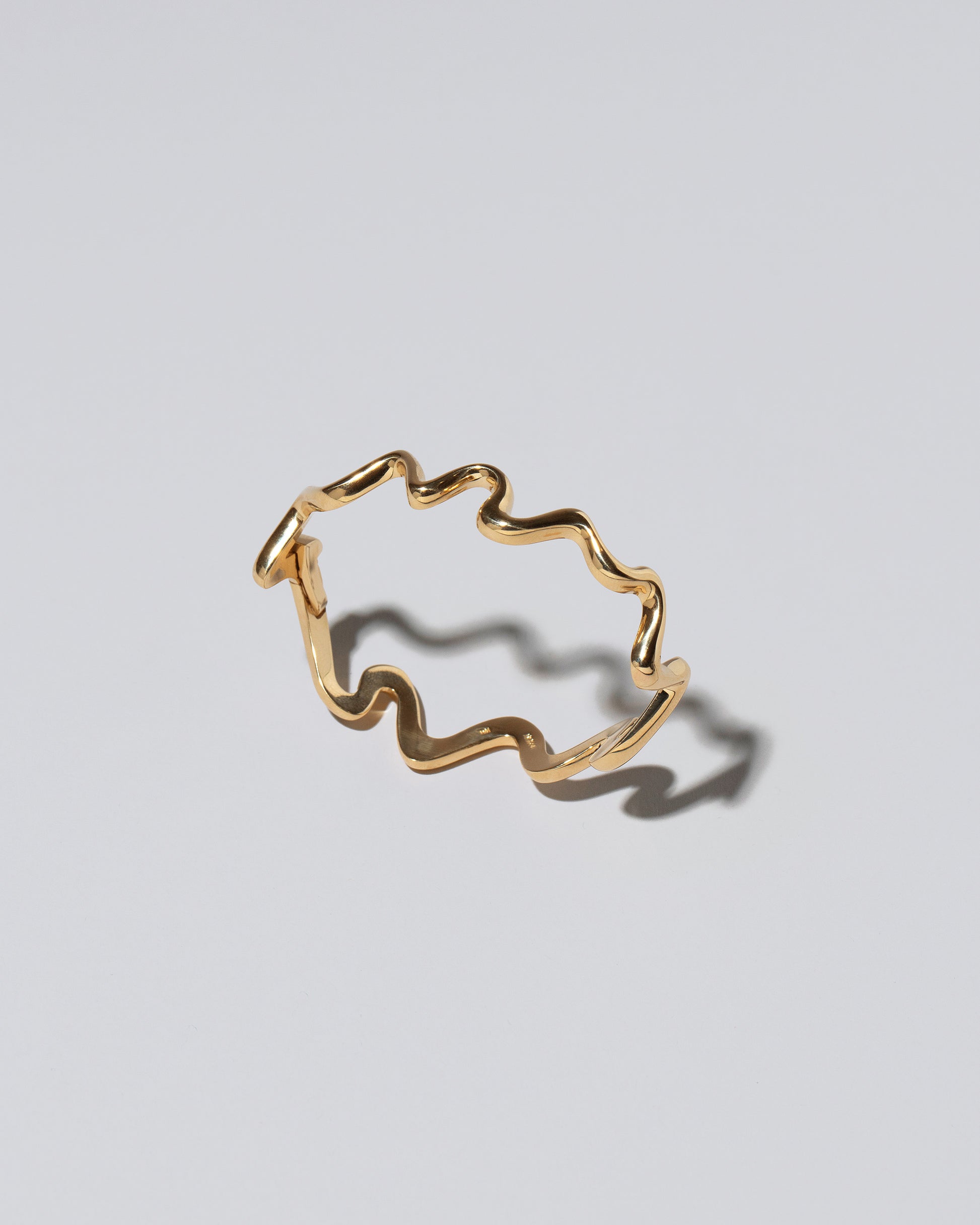 Cut-Outs Bracelet on light color background.