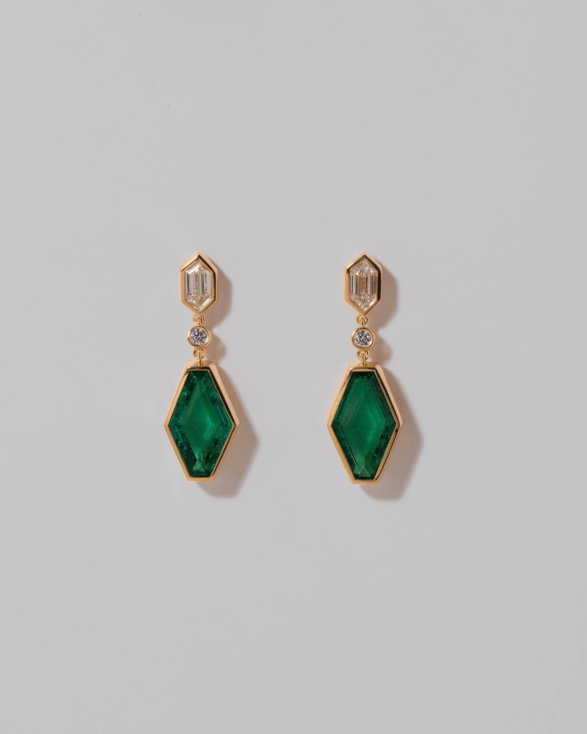Trillium Earrings on light color background.