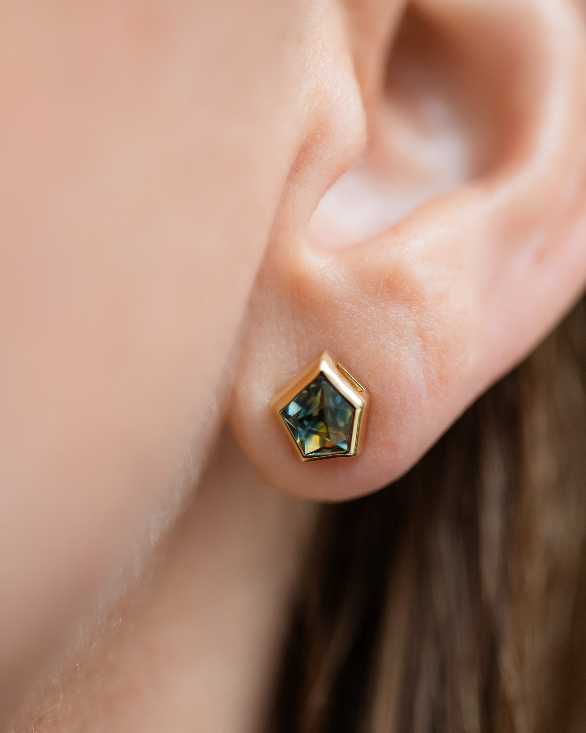 Teal Bicolor Sapphire Geyser Stud Earrings on model.