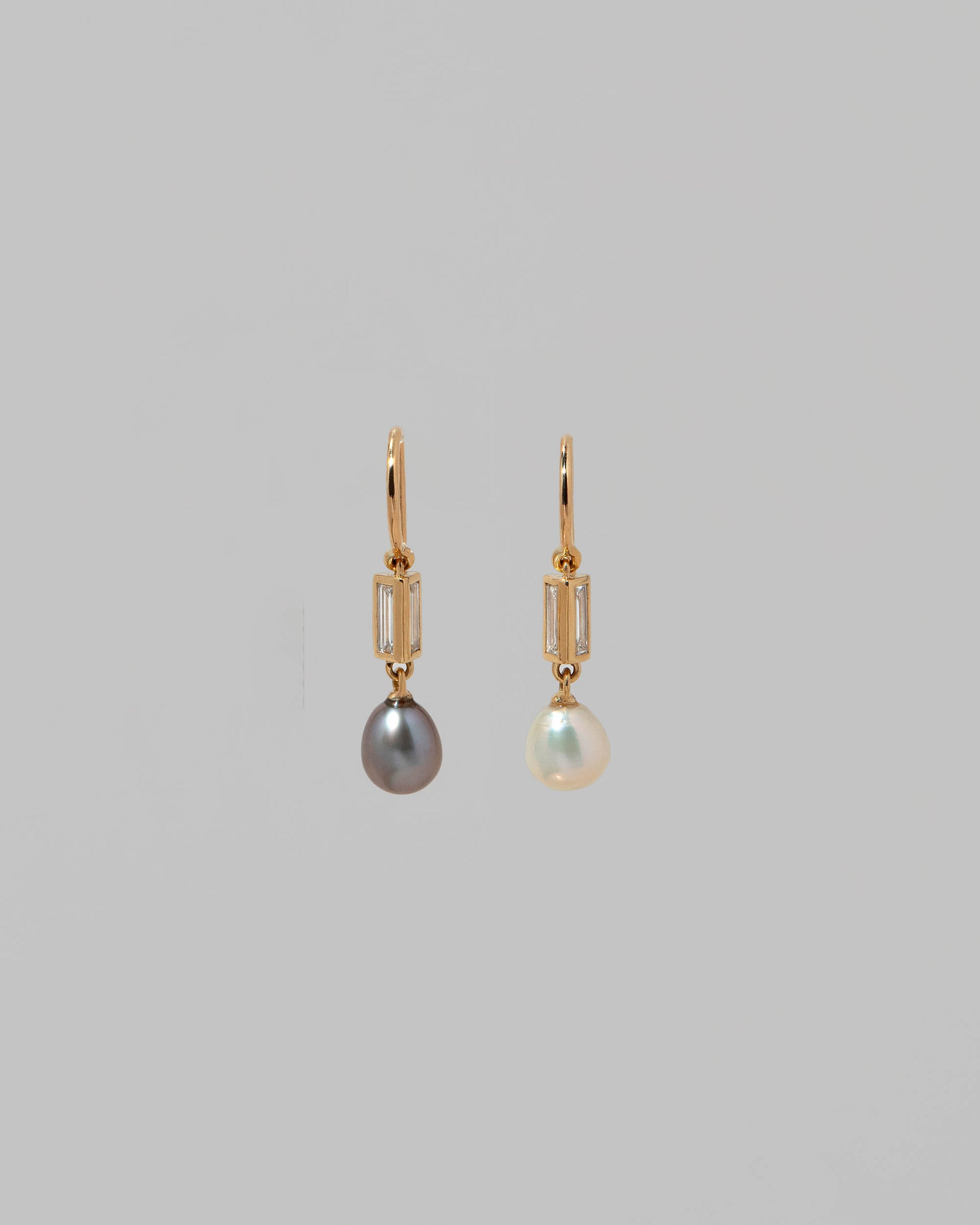 Poseidon Earrings on light color background.