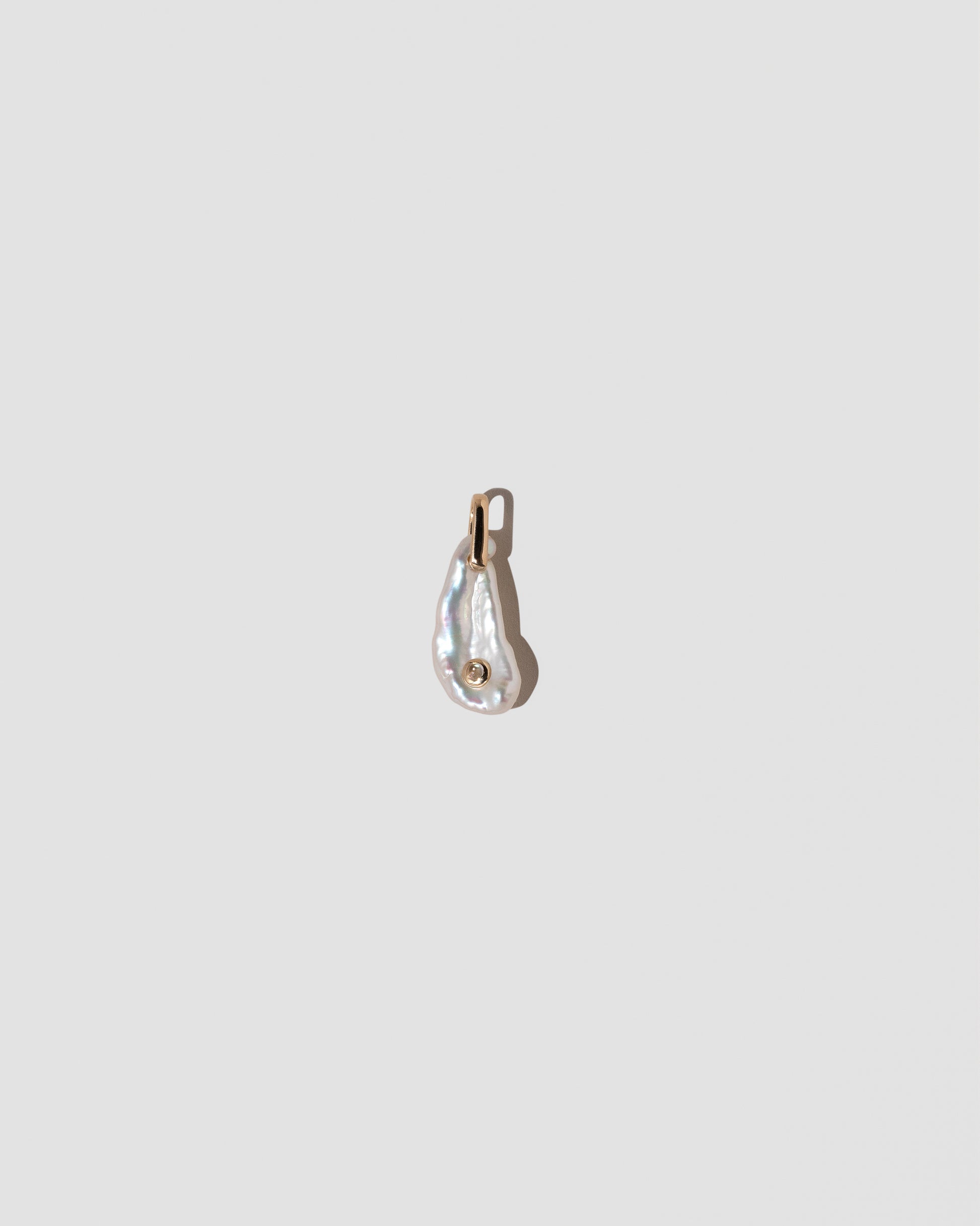 June Birthstone Pearl Pendant With Moonstone on light color background.