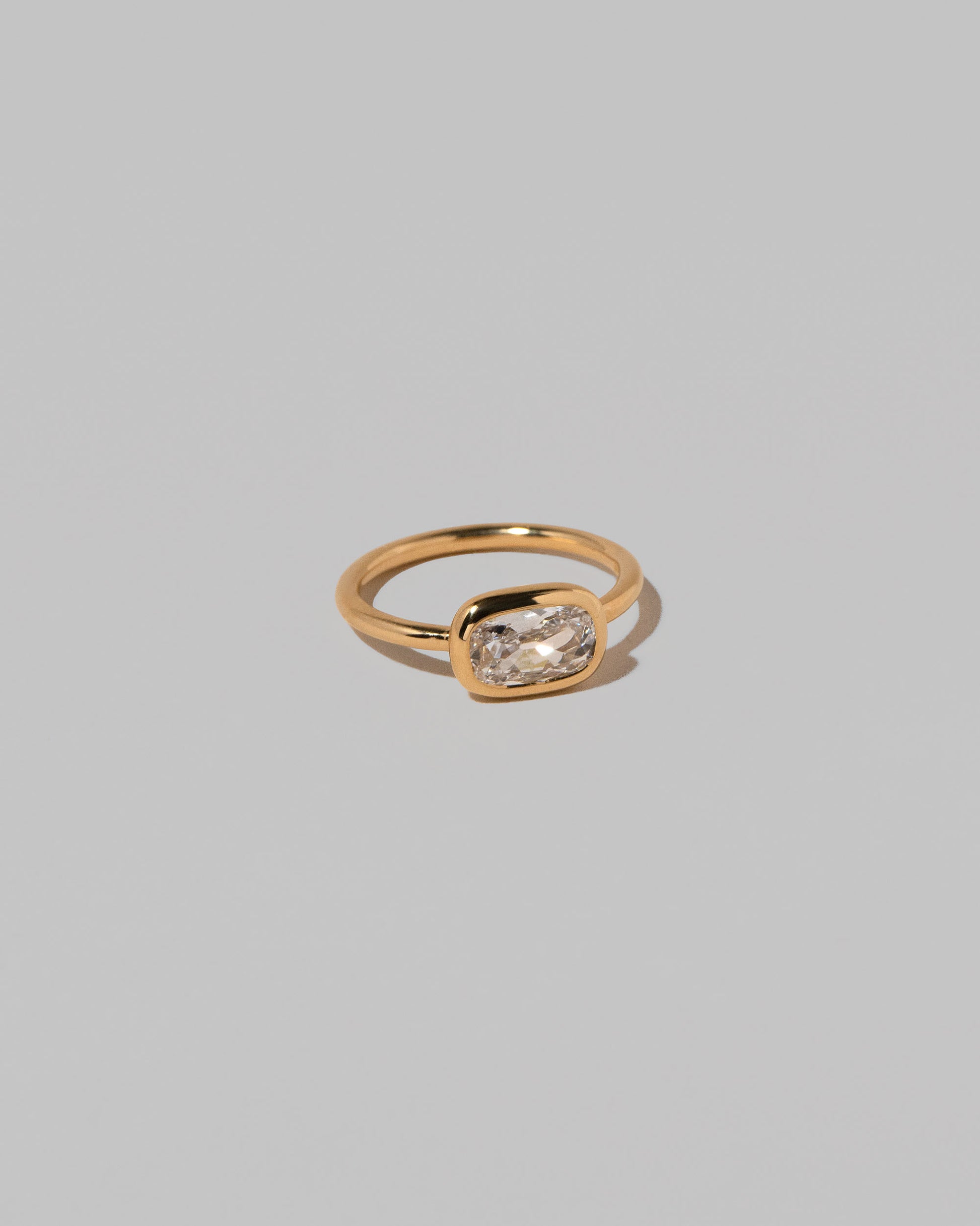 View from the side of the Gusher Diamond Ring 017 on light color background.