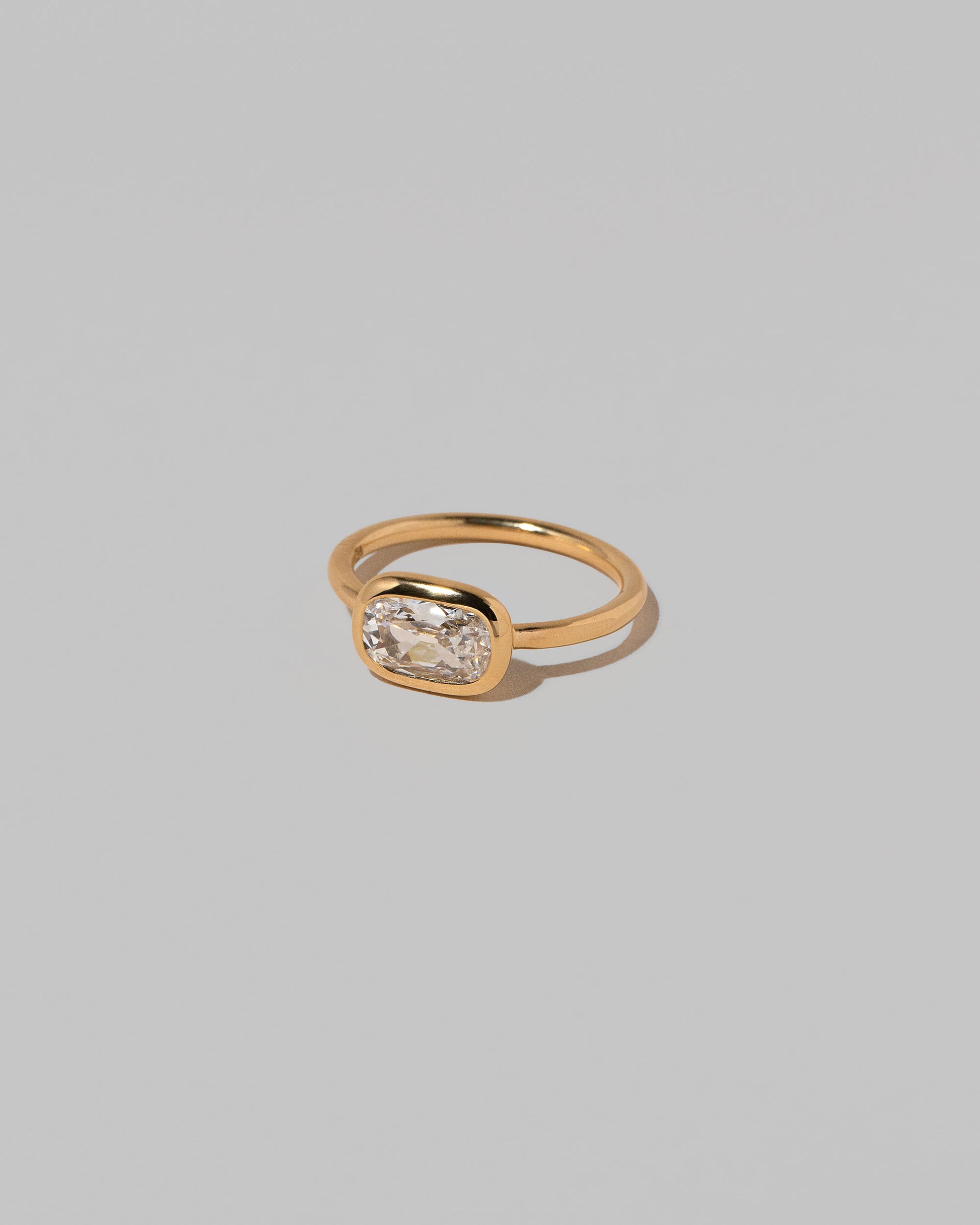 View from the side of the Gusher Diamond Ring 017 on light color background.