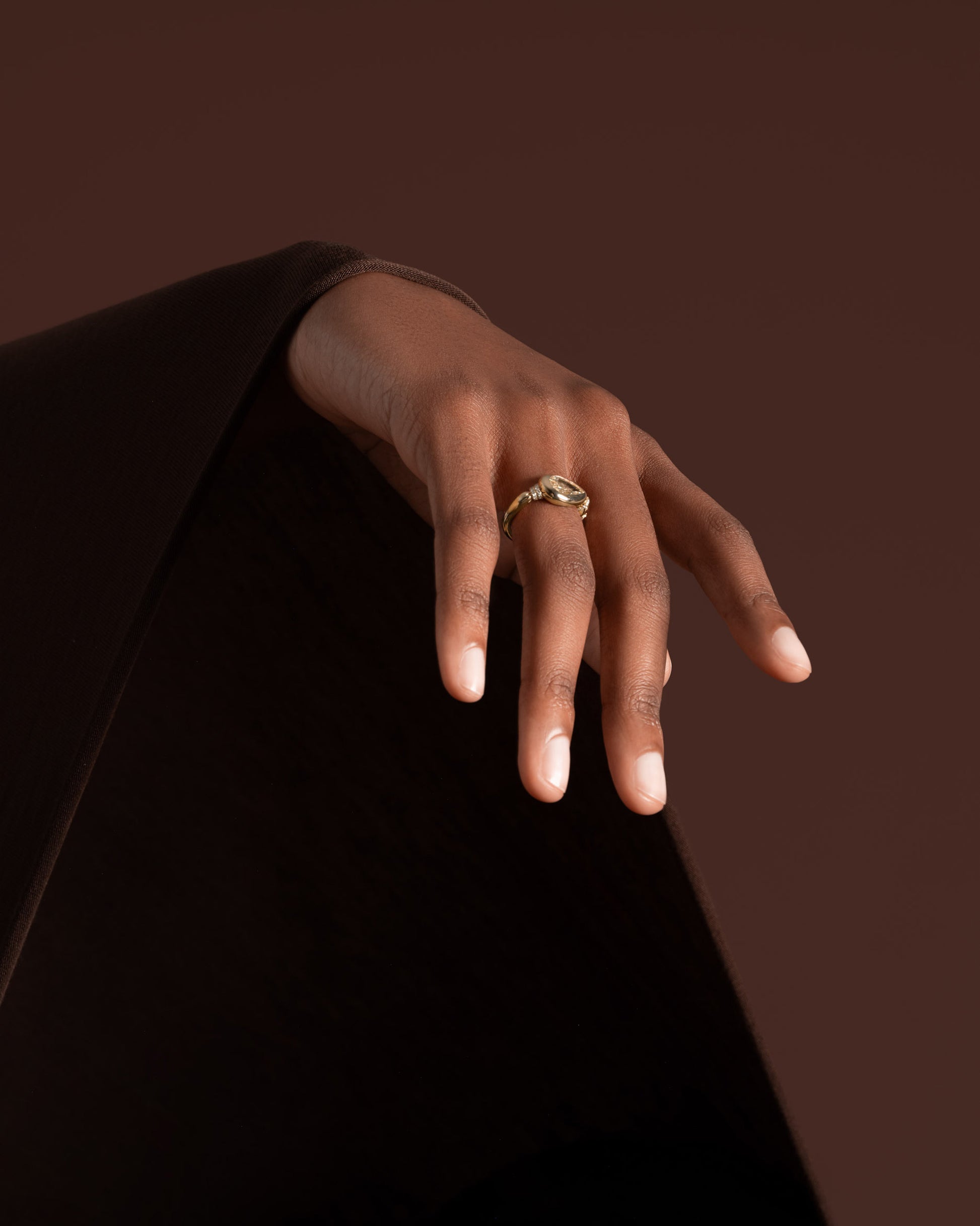 Styled image featuring the Bind Ring on model.