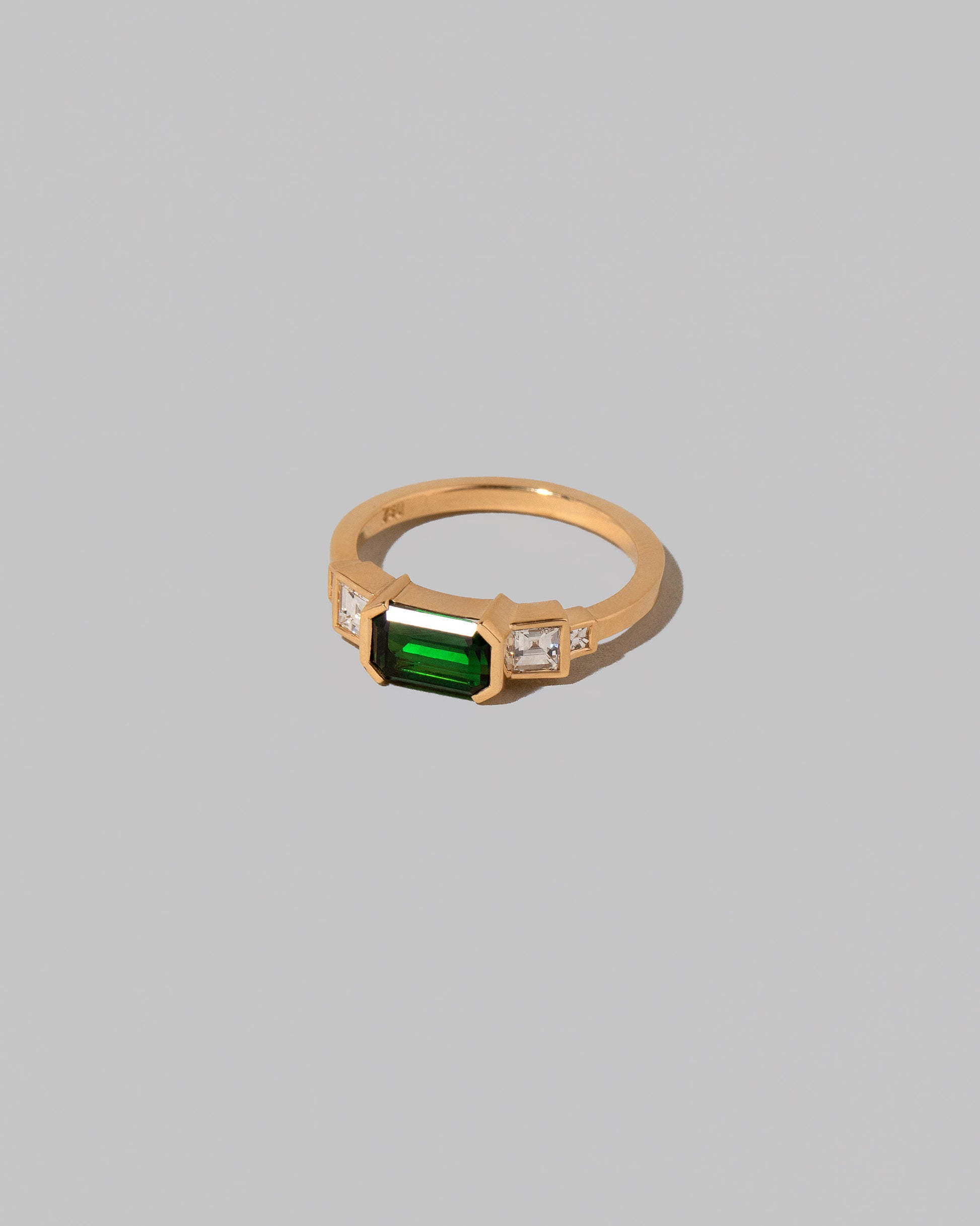 View from the side of the Amaranth Ring on light color background.