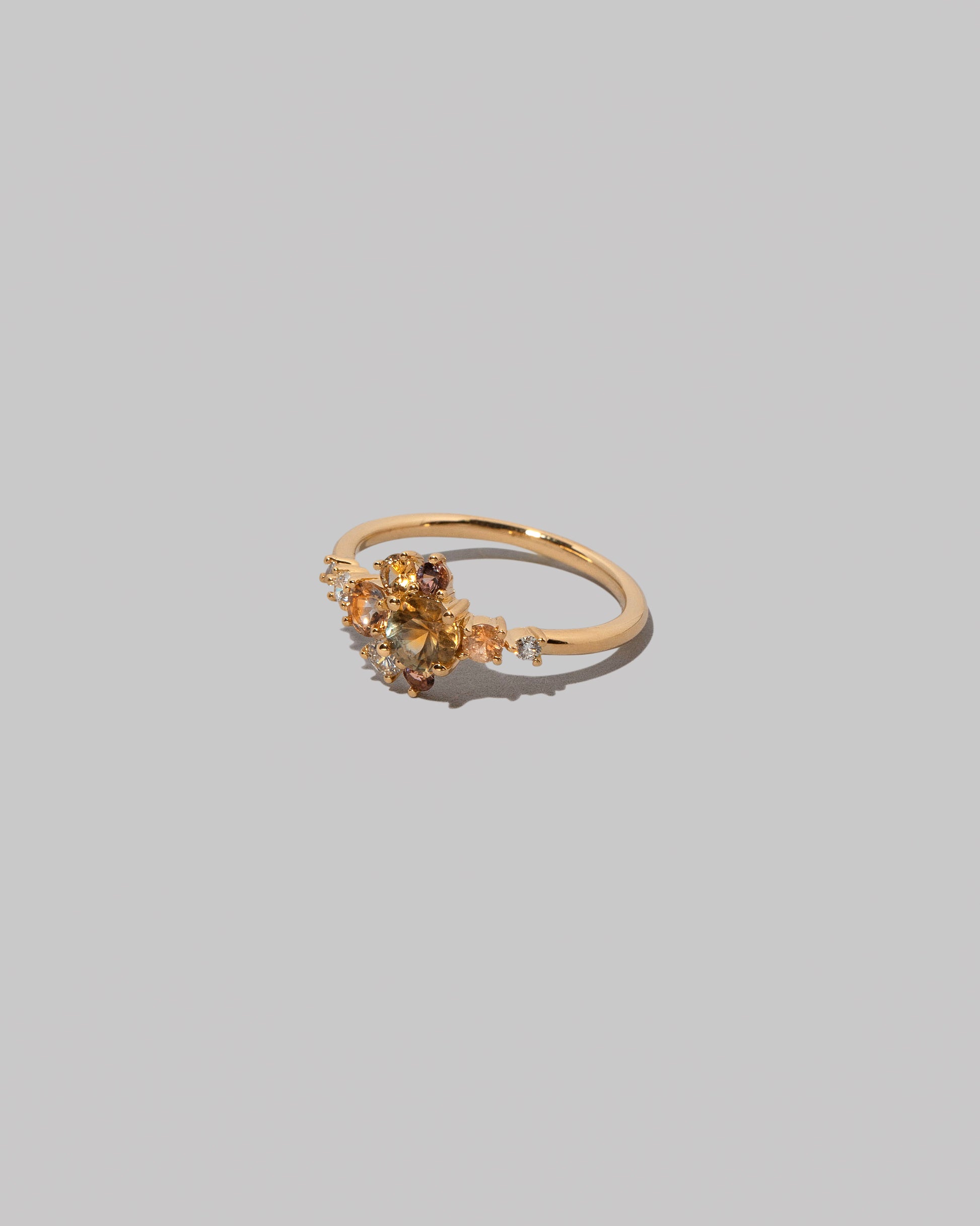 View from the side of the Sapphire Anthea Ring on light color background.