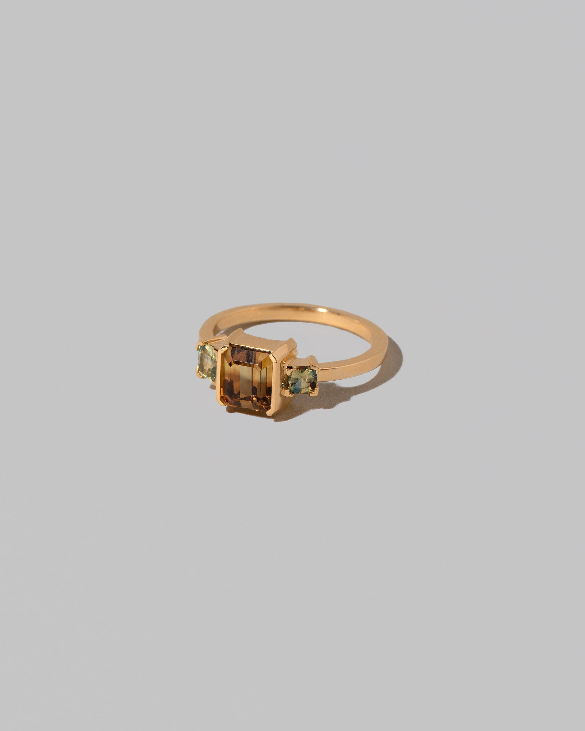 View from the side of the Brassia Ring on light color background.