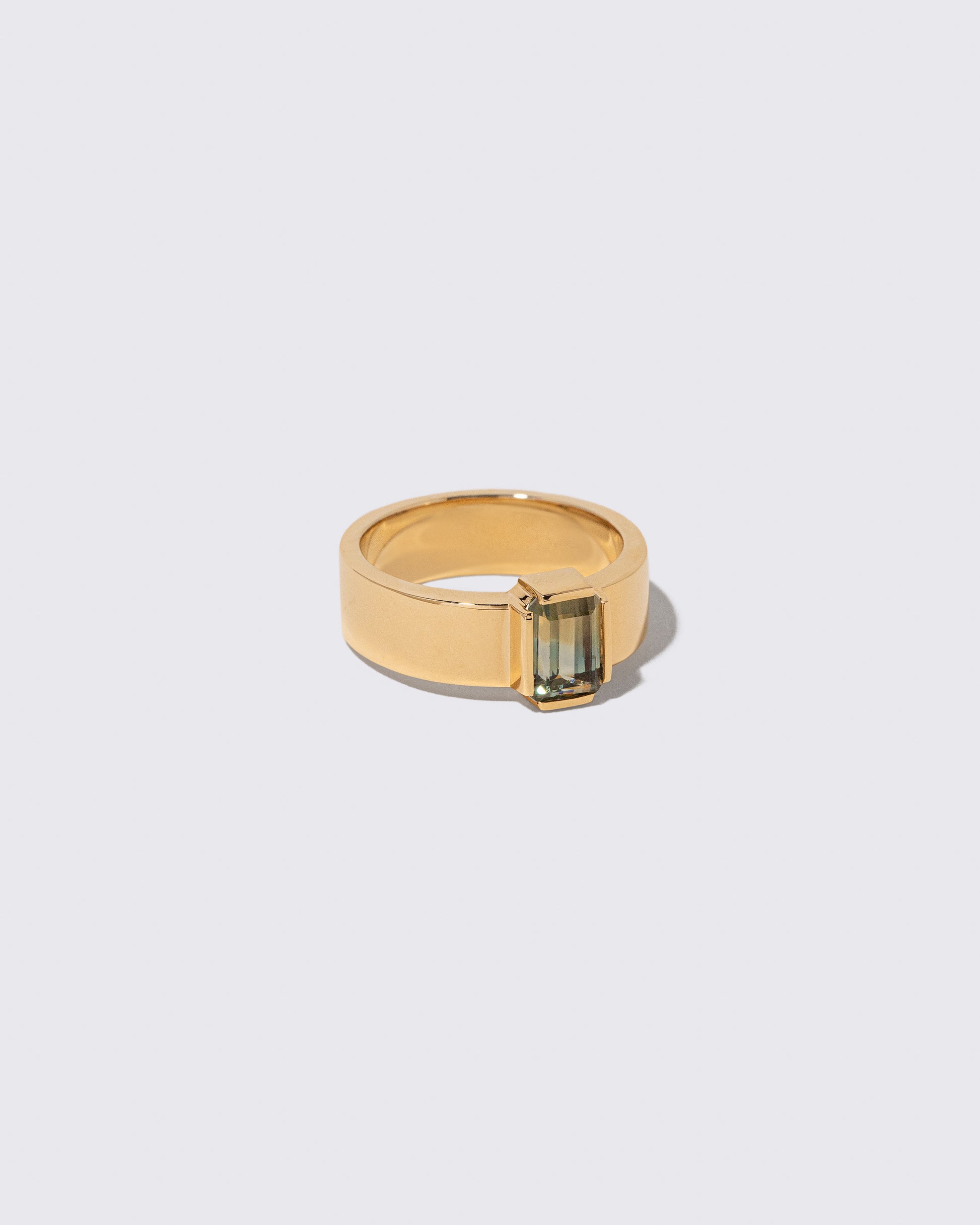 View from the side of the Sapphire Double Ring on light color background.
