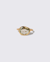 Green Sapphire Gusher Ring on light color background.