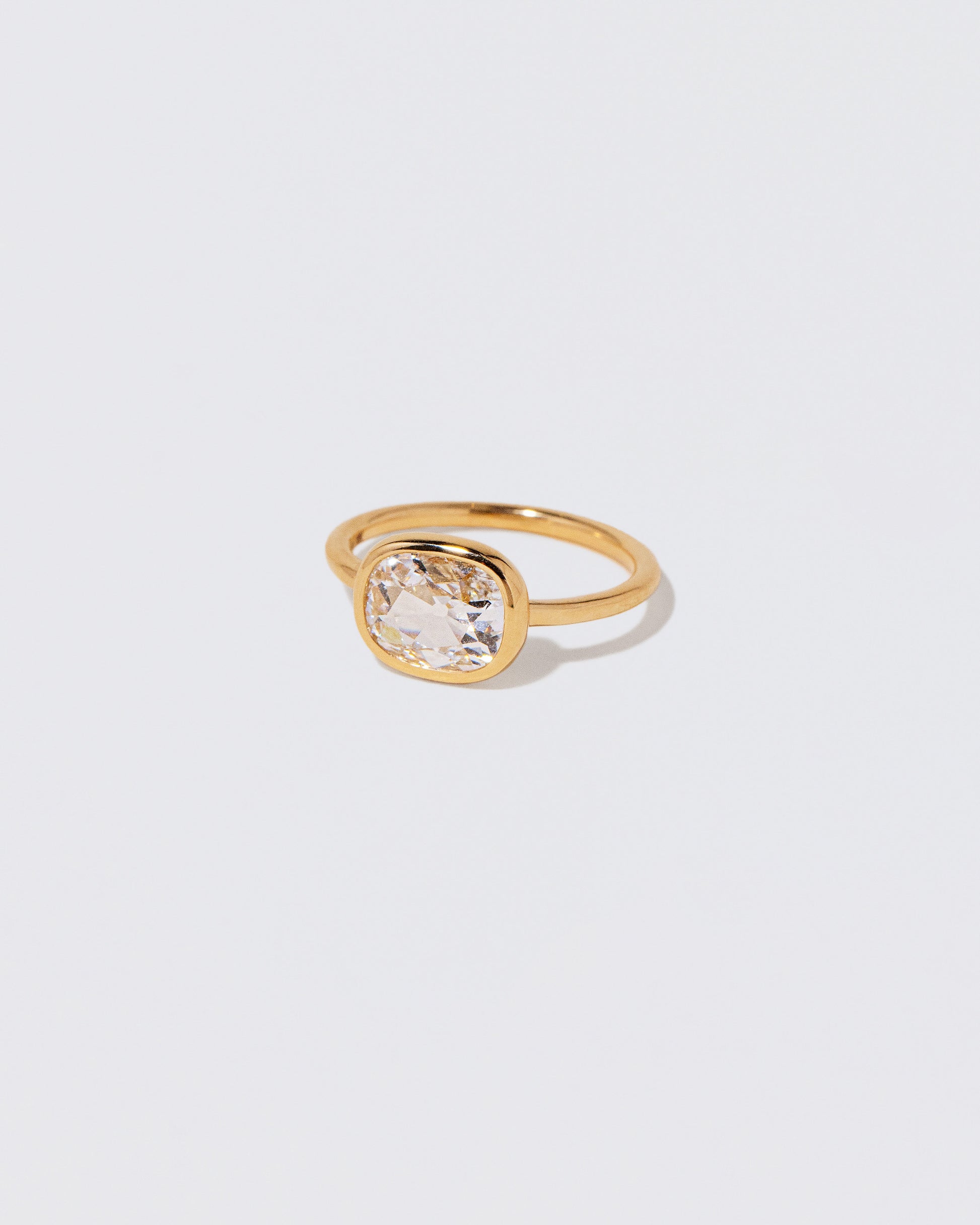 View from the side of the Gusher Diamond Ring 060 on light color background.