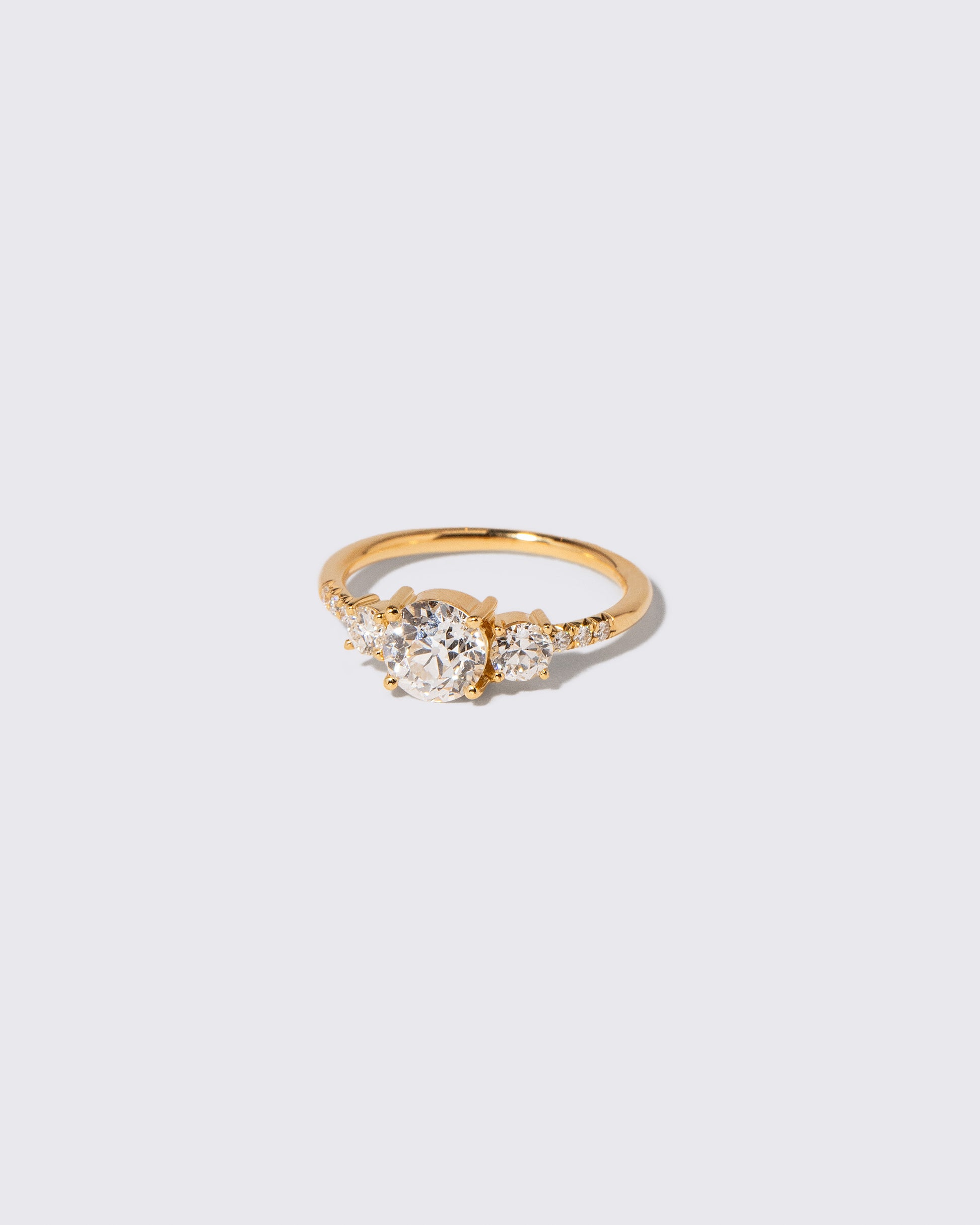 View from the side of the White Diamond Orion Ring on light color background.