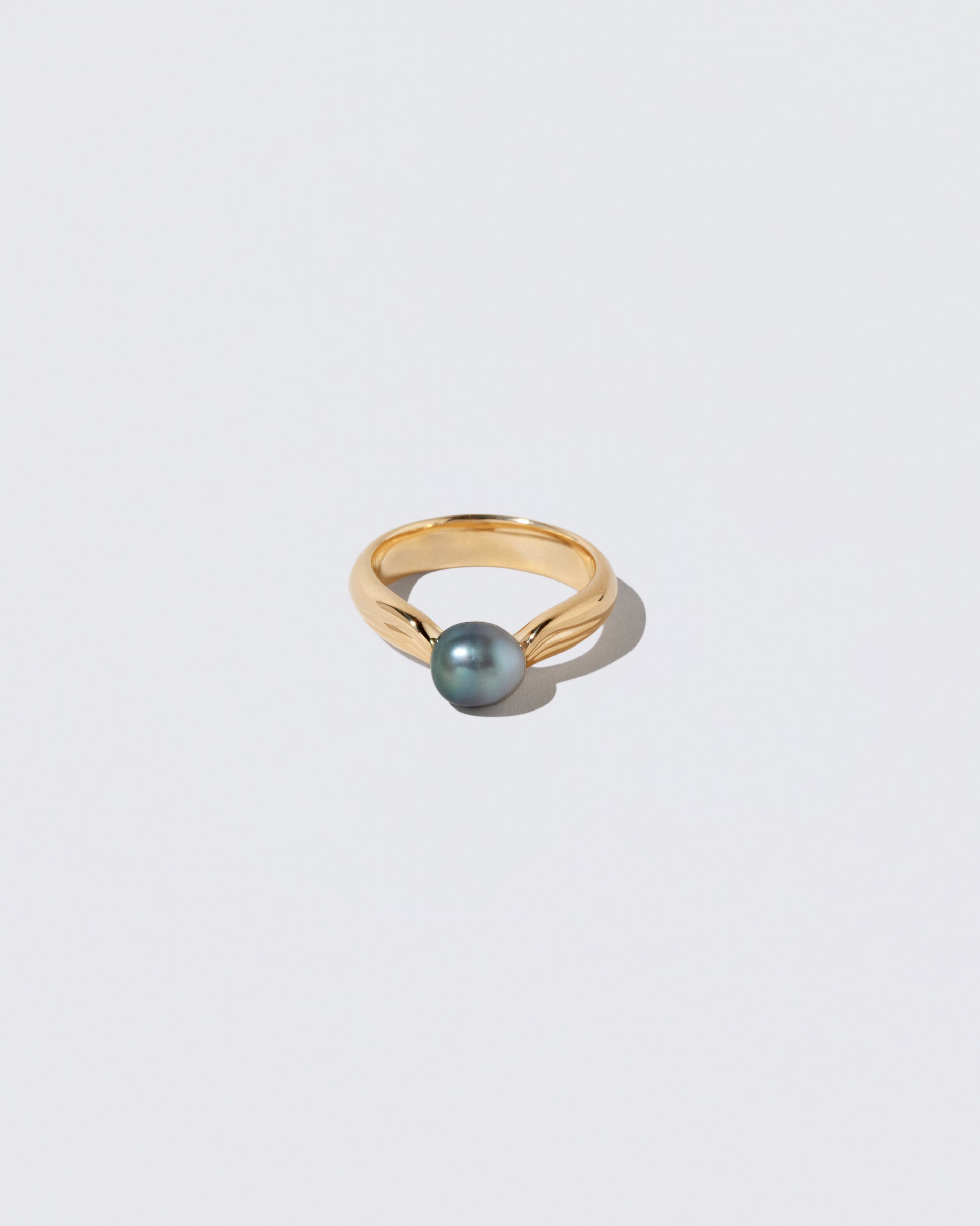 Scylla Ring on light color background.