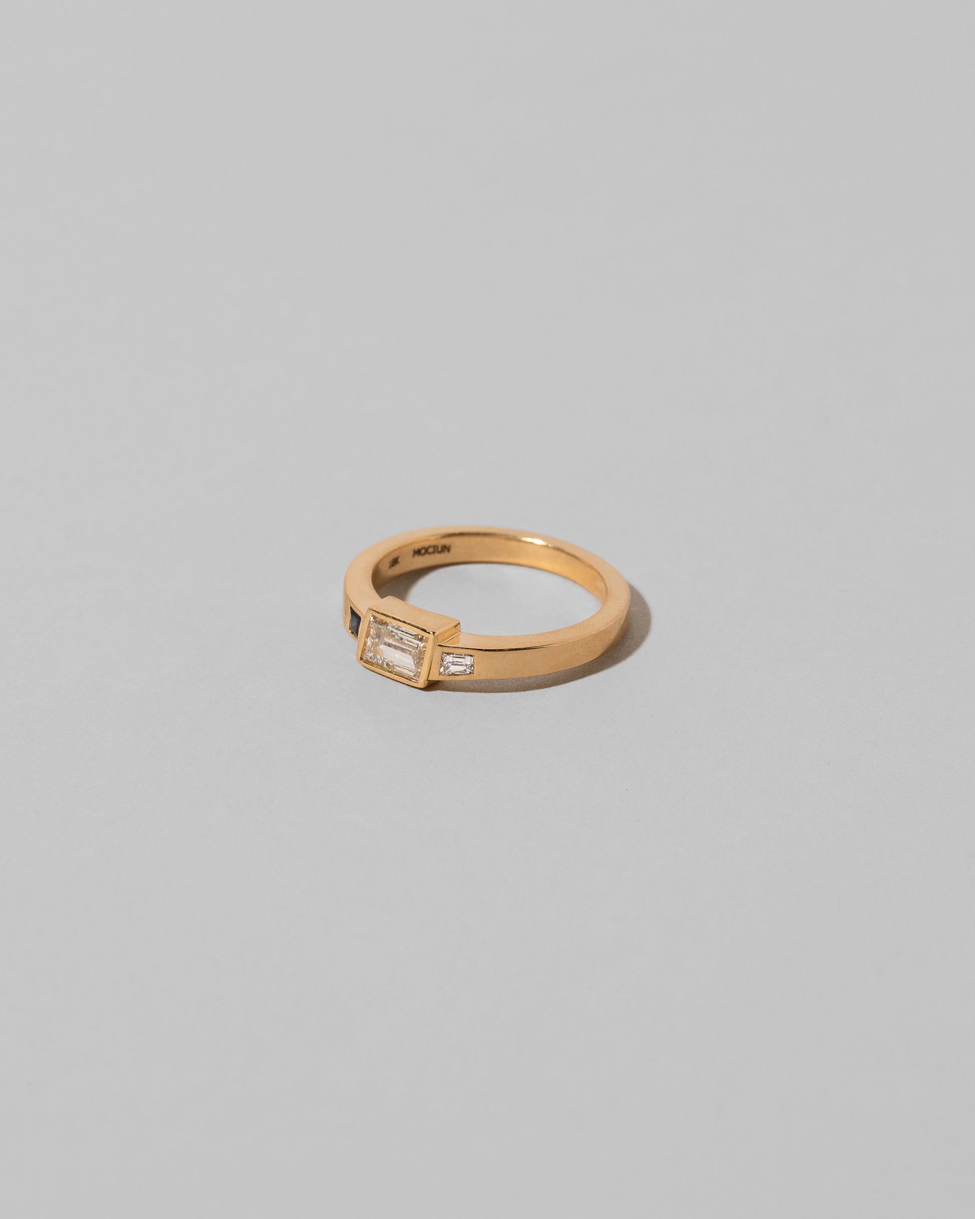 View from the side of the This Way Ring on light color background.