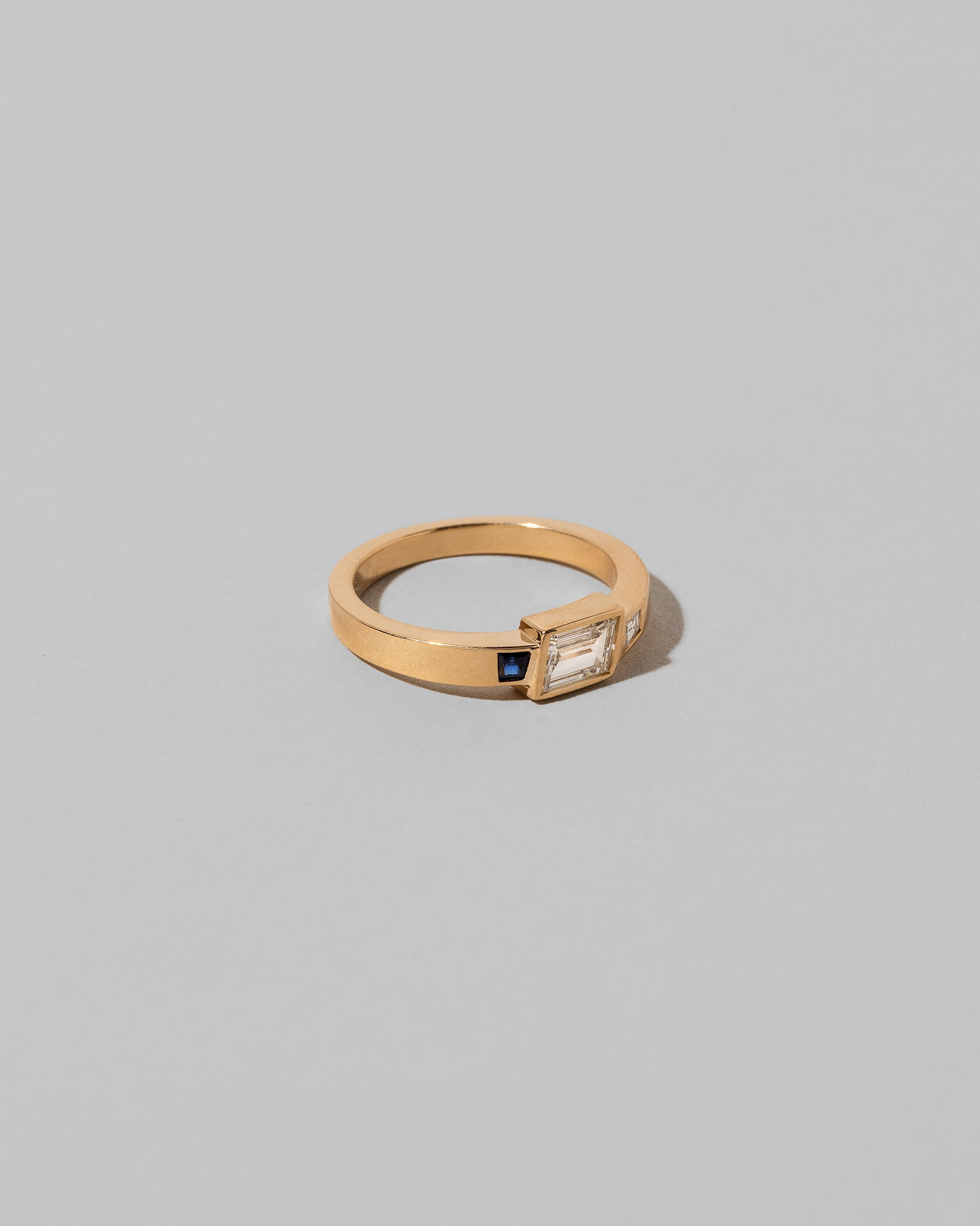 Closeup details of the This Way Ring on light color background.