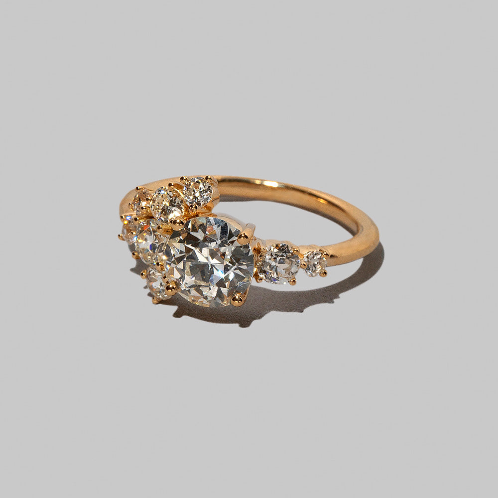 product_details::Closeup details of a past version of the Diamond Vega Ring on light color background.