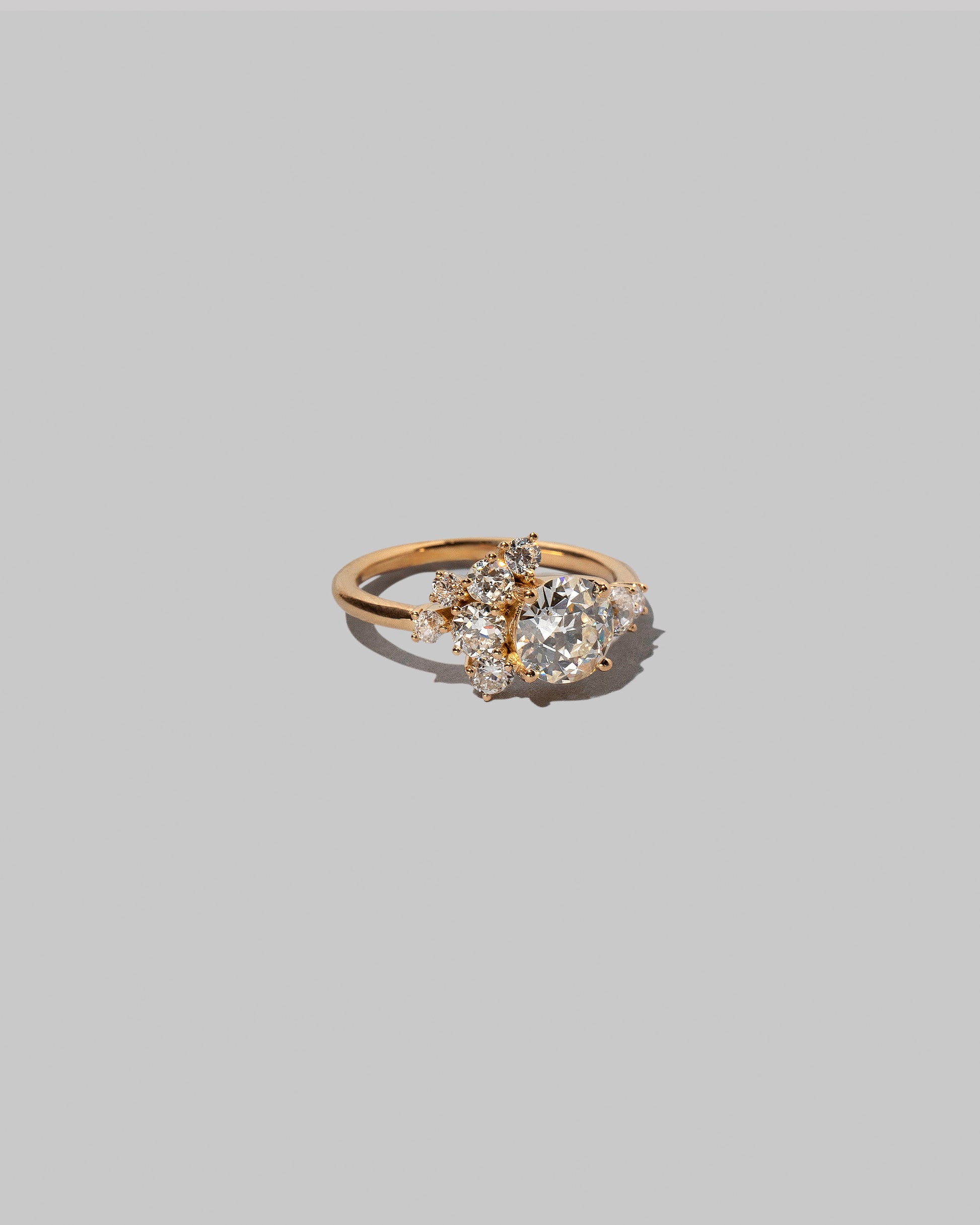 View from the side of a past version of the Diamond Vega Ring on light color background.