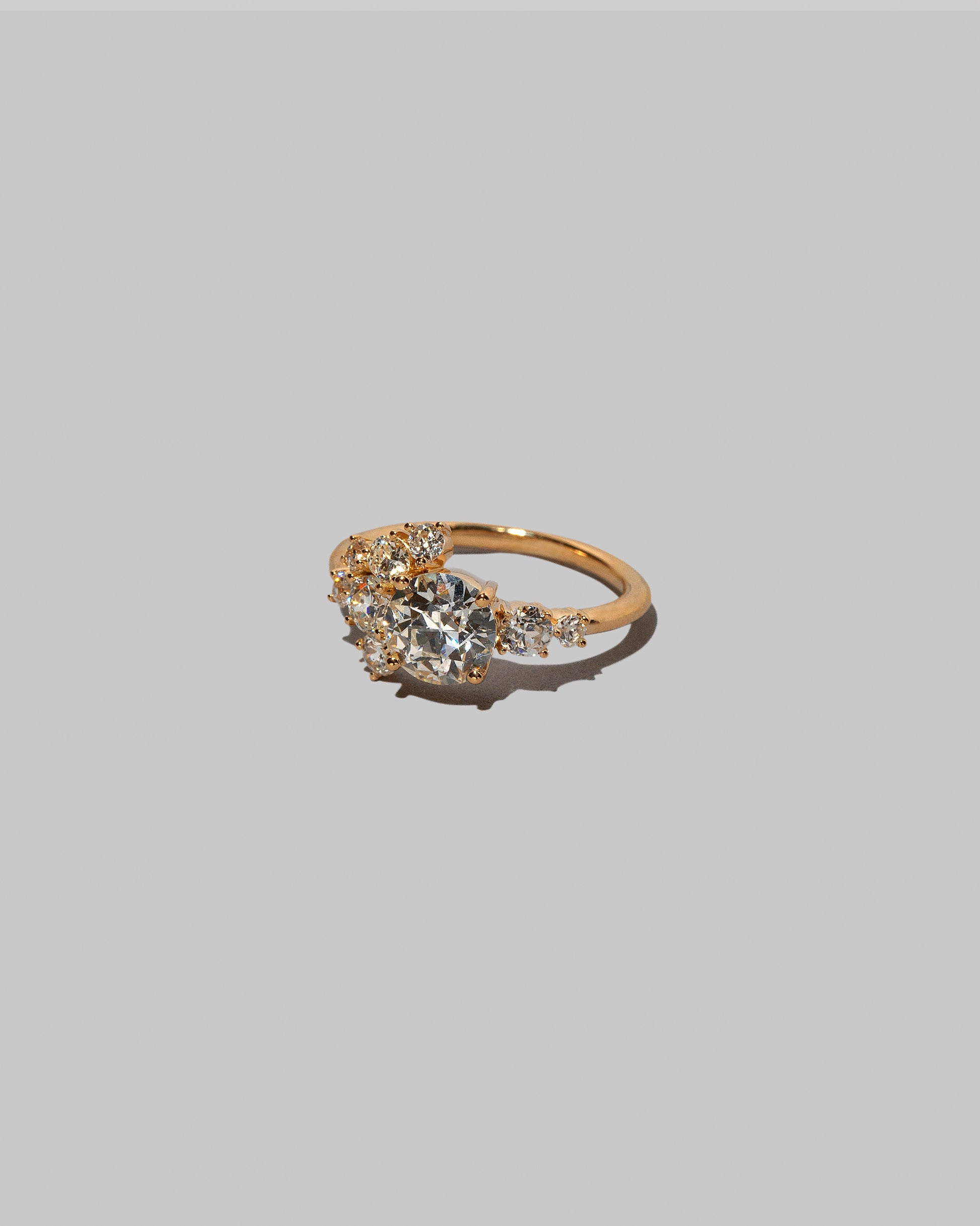 View from the side of a past version of the Diamond Vega Ring on light color background.