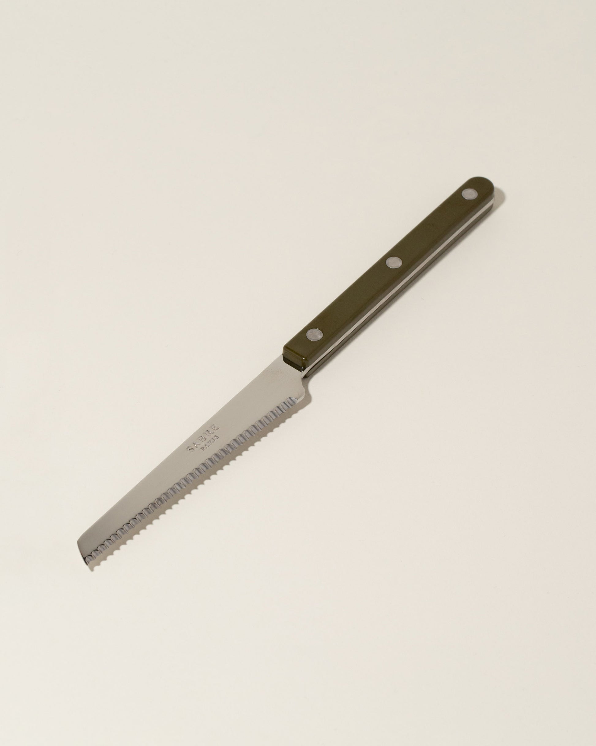 Sabre Paris Green Fern Tomato Knife on light color background.