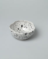 Recreation Center Black Speckle Flower Bowl on light color background.