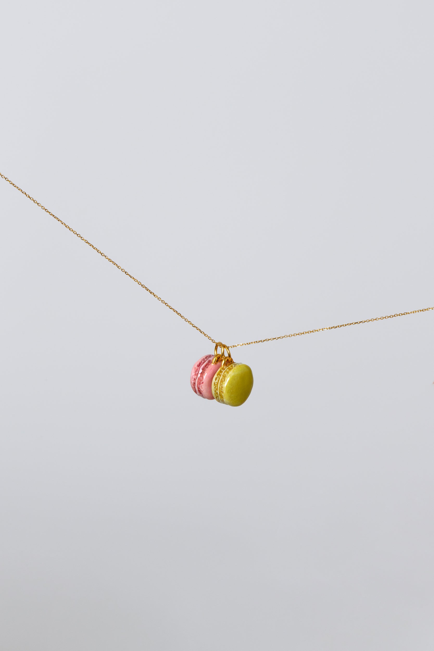 Macaron Charms in limited edition Rose and Pistachio light color background..