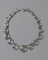 CRZM Sterling Silver Serpentinite Necklace on light color background.