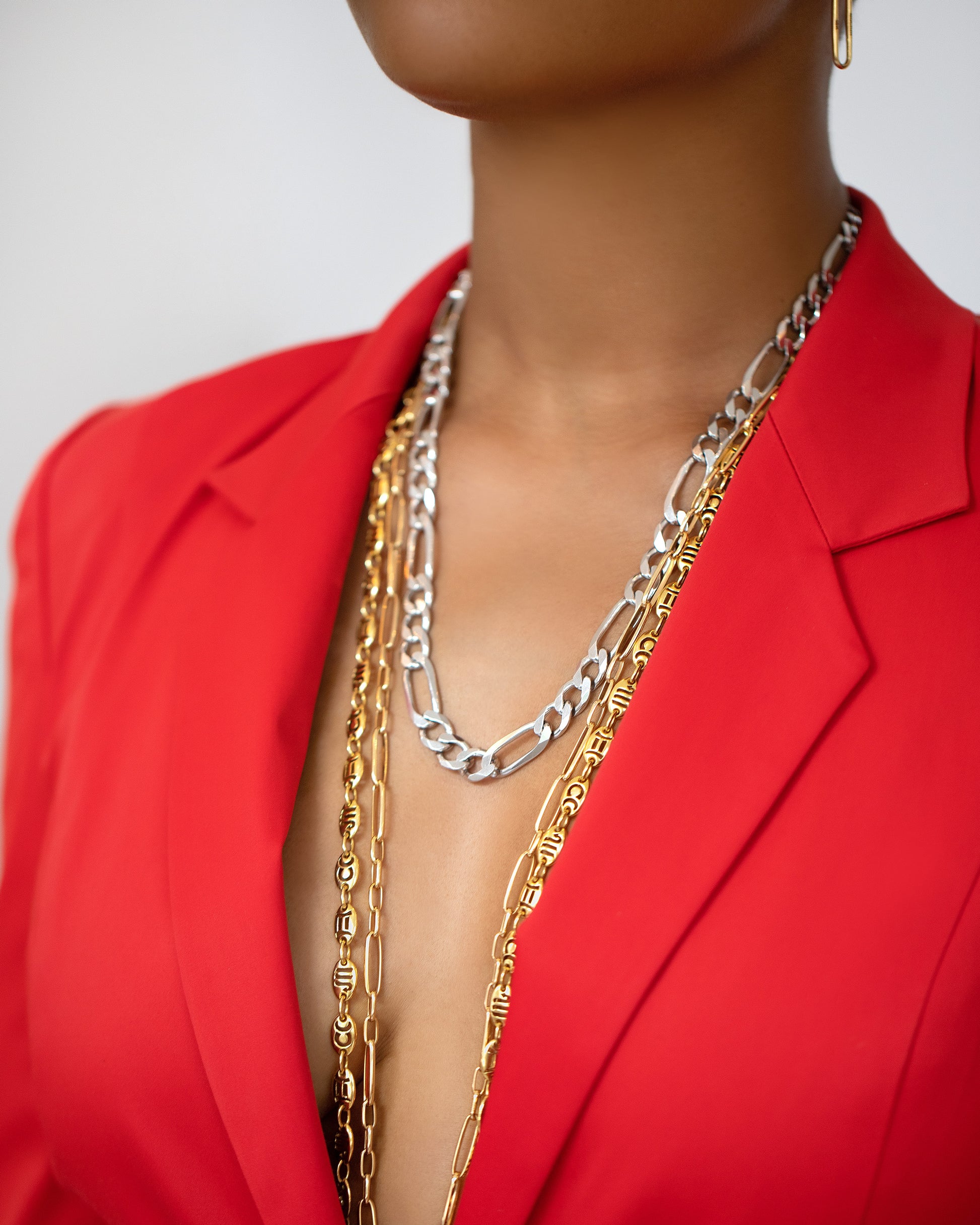 Silver Figaro Chain, Long Loop Chain Necklace and Jean Paris Zodiac Anchor Chain Necklace on model.