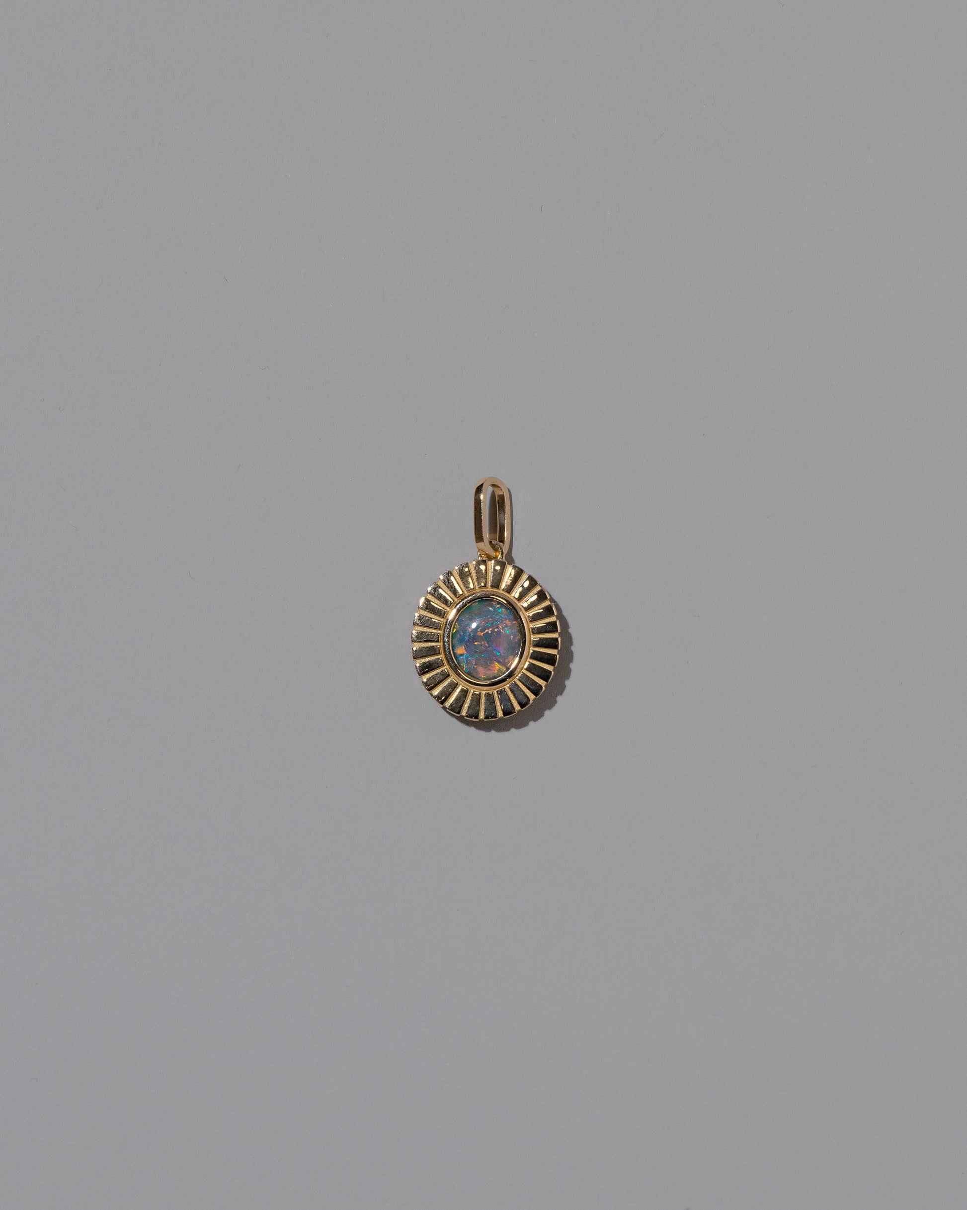 New Growth Pendant on light color background.