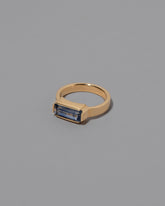 View from the side of the Double Over Ring on grey color background.
