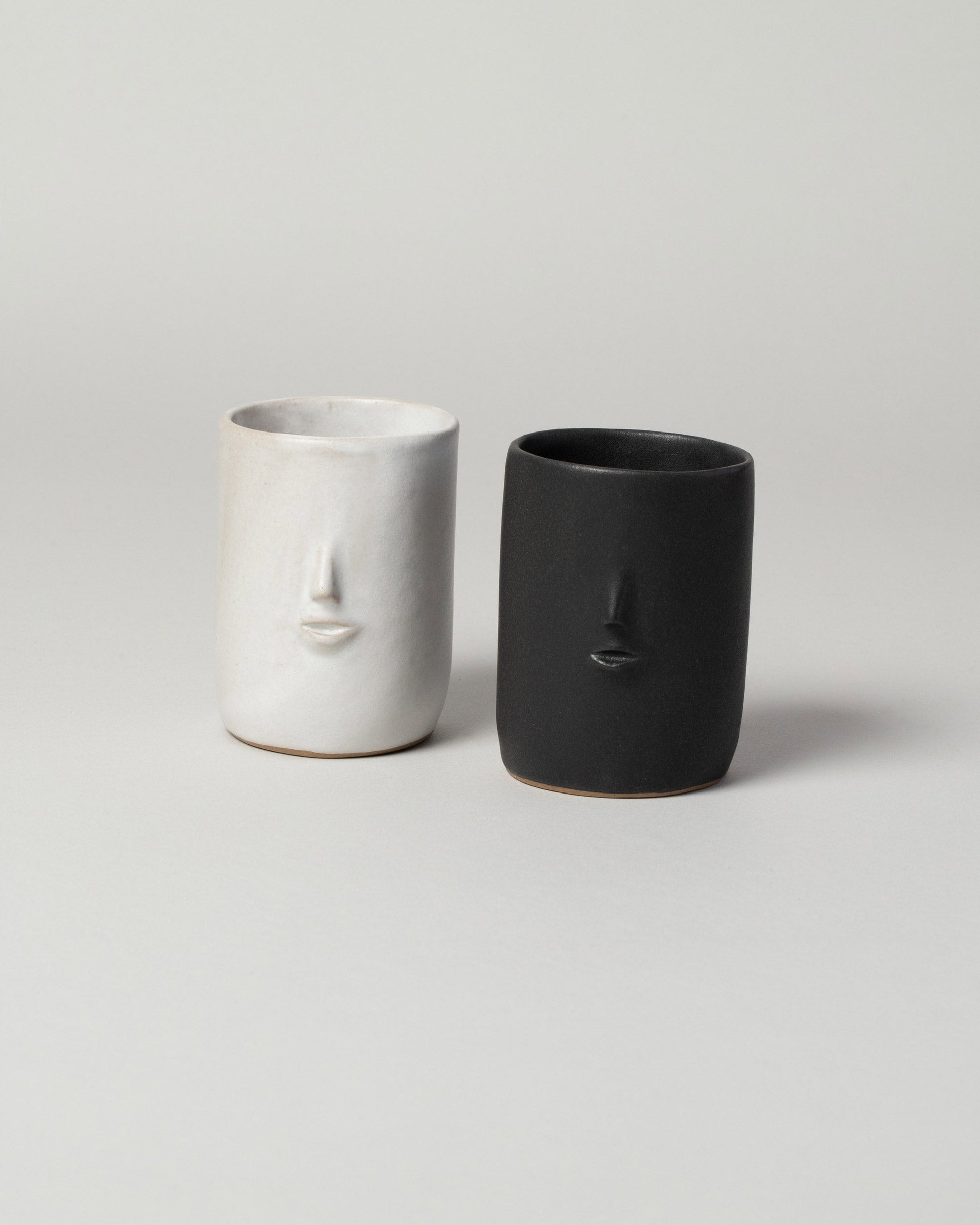 Group of  Rami Kim Mini Face Tumbler on light color background.