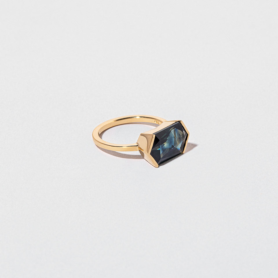 product_details::Closeup details of the Callisto Ring on light color background.